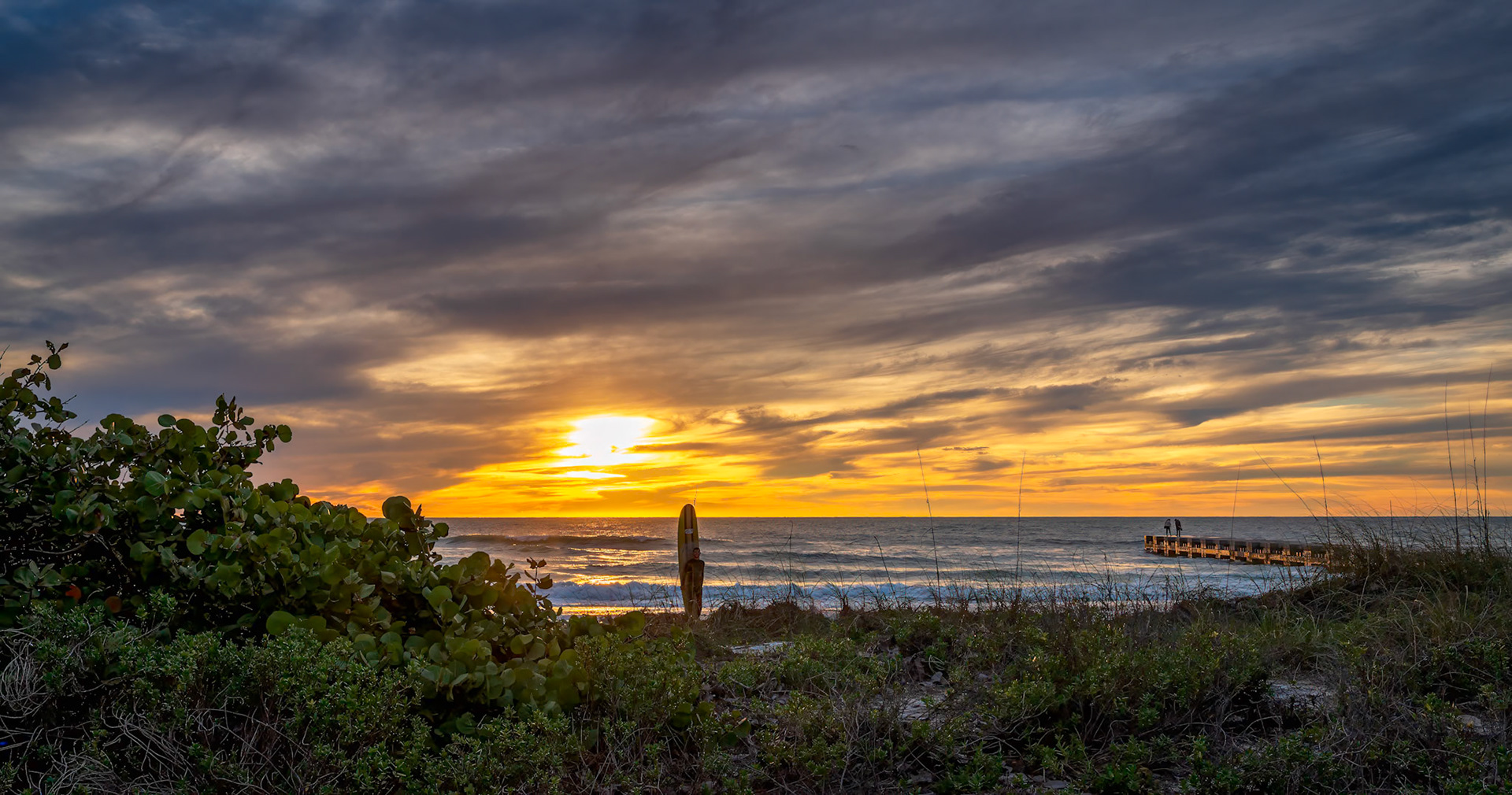Scenes From A Beach - The sun sets across the Gulf of Mexico and over Cortez Beach on Anna Maria Island, Florida.