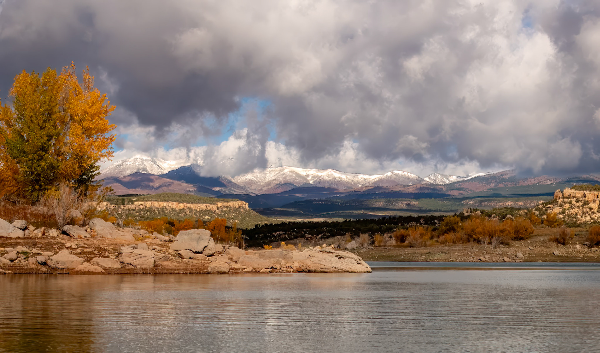On The Road To Monument Valley - Hidden treasure on the way to Monument Valley from Moab.  View across Recapture Reservoir with the Abajo Mountains in the background.