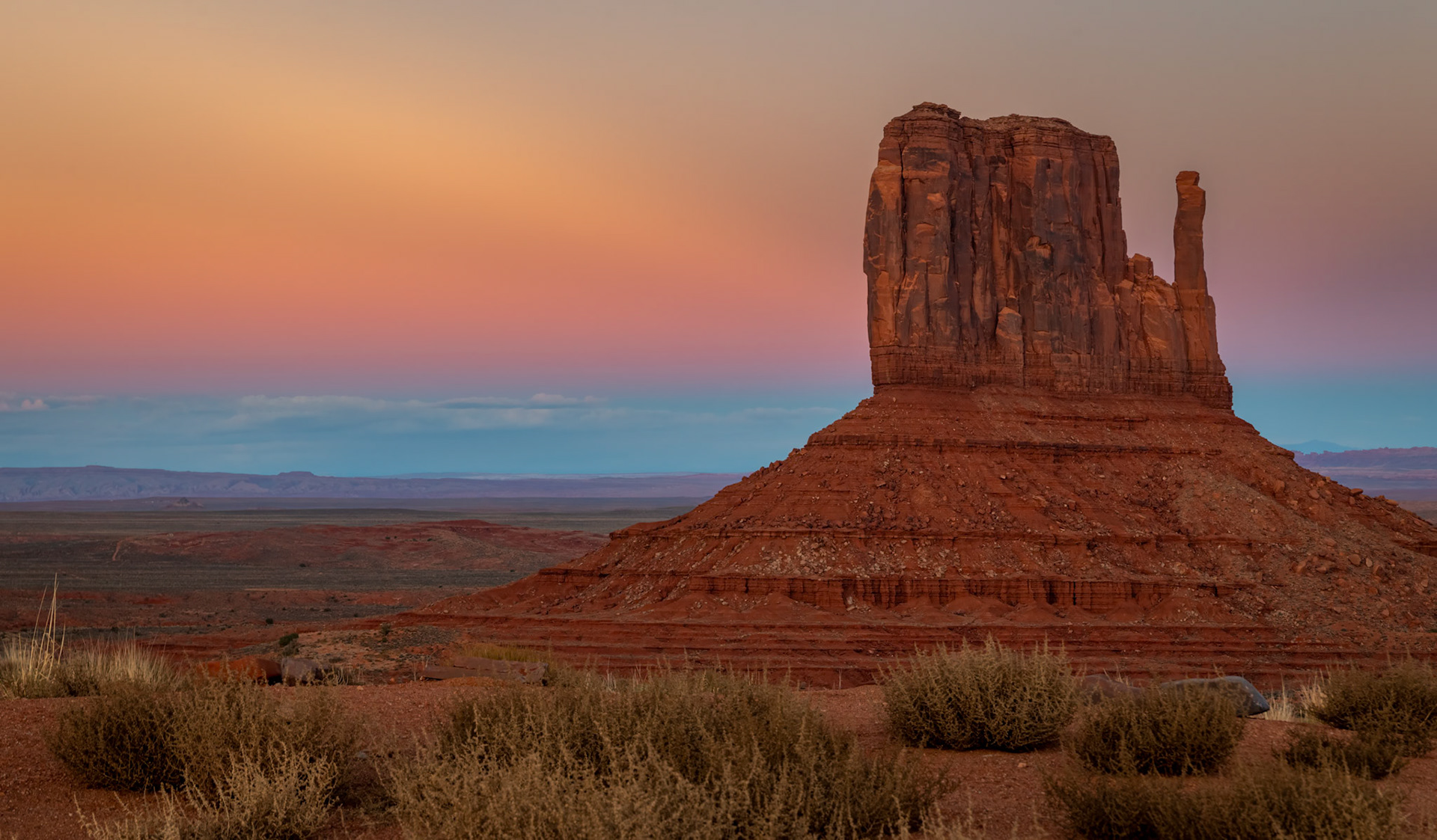 Monument Valley Sunset - The beautiful colors from the back side of the sunset painting Monument Valley and the West Mitten Butte.