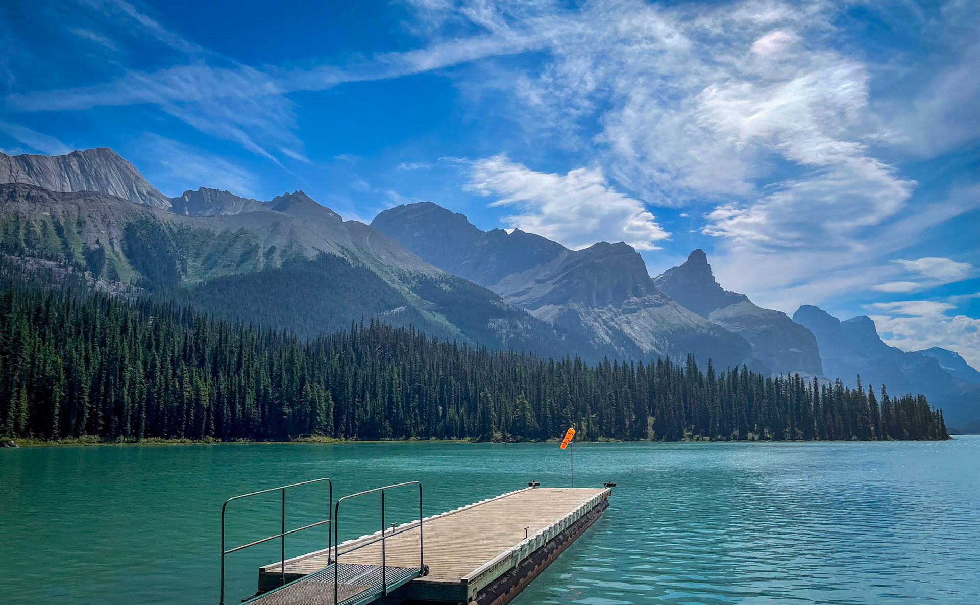 Brilliant Shades of Blue - The beautiful colors of a blue sky against the turquoise glacier fed Maligne Lake, Jasper National Park.  Photo credit to my wonderful wife.