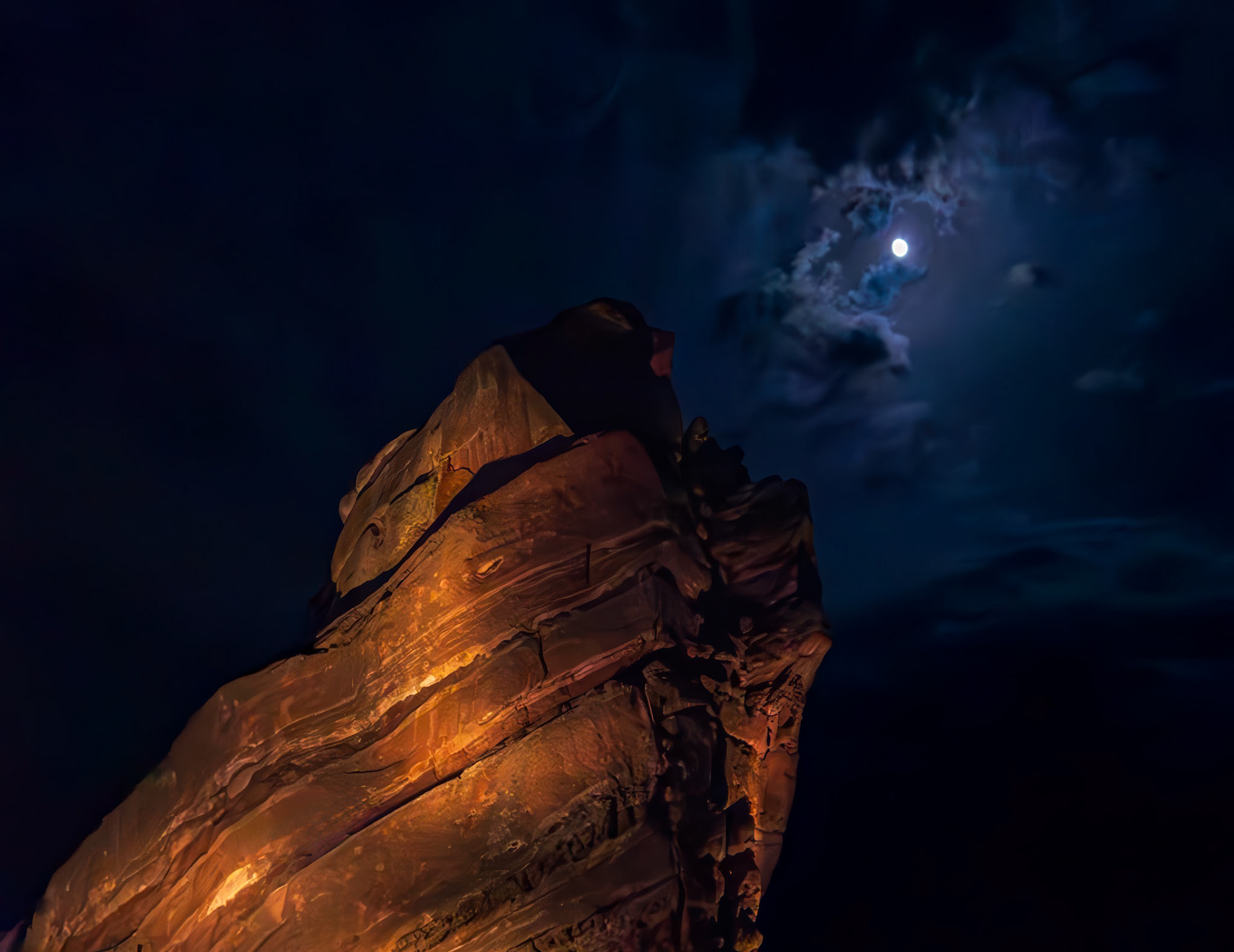 Ship Rock Illumination - captured at theRed Rocks Park and Amphitheatre in Morrison, Colorado.  Ship Rock is the name of this sandstone monolith, illuminated from the venue lights and a moonlit sky.
