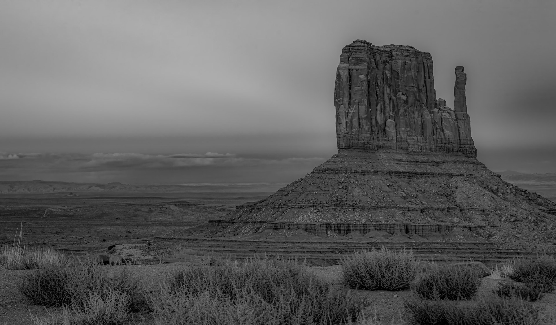 Monument Valley Sunset - The beautiful layers and shades from the back side of the sunset painting Monument Valley and the West Mitten Butte.