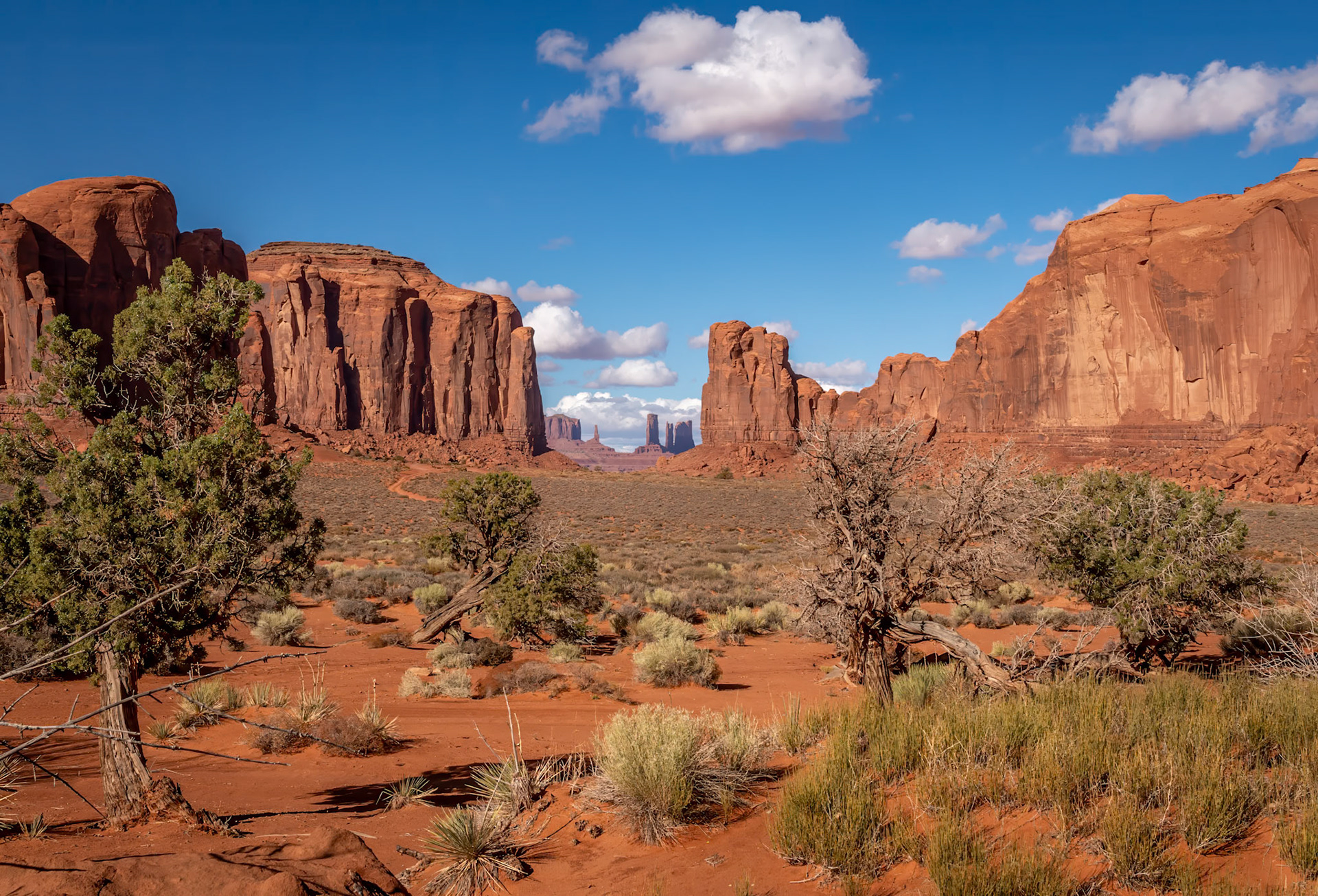 Mythical Sandstone Masterpieces - Majestic vista through the mesas and buttes of Monument Valley, Arizona
