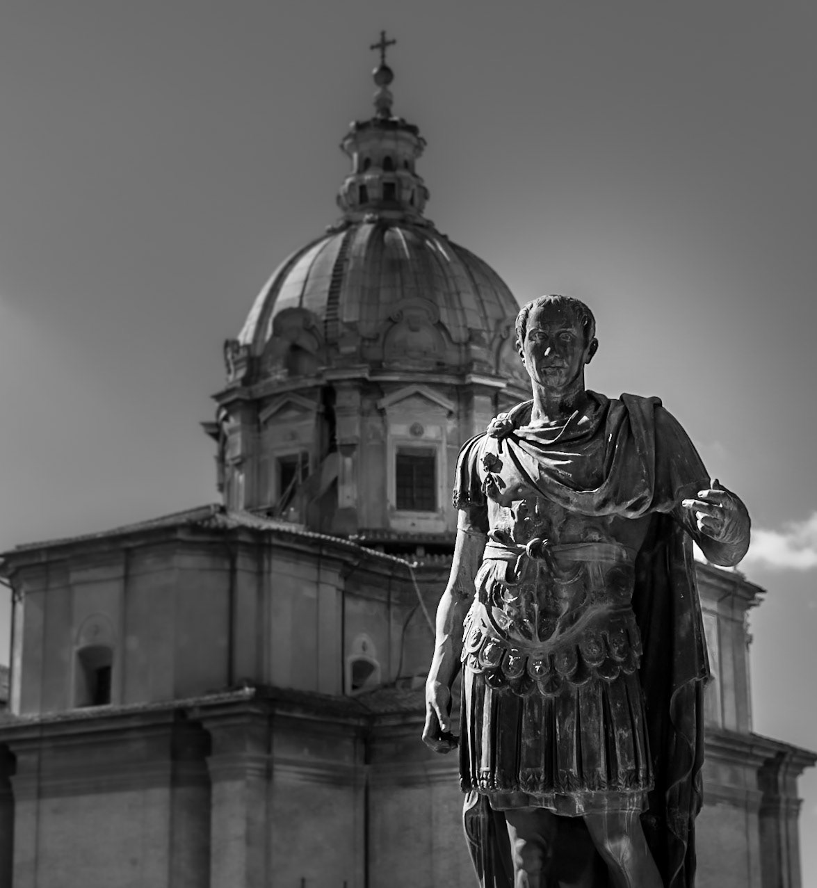 Julius Caesar - This statue of the Roman dictator is located on Via dei Fori Imperiali.  Behind is the Church of St Luke and St Martina, of Baroque architecture from the 7th century