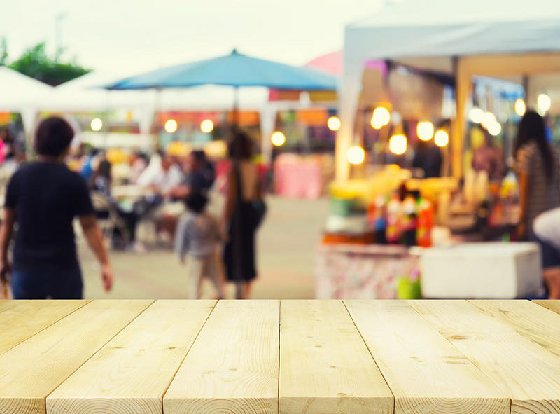 A blurry image of a crowd at a outdoor festival