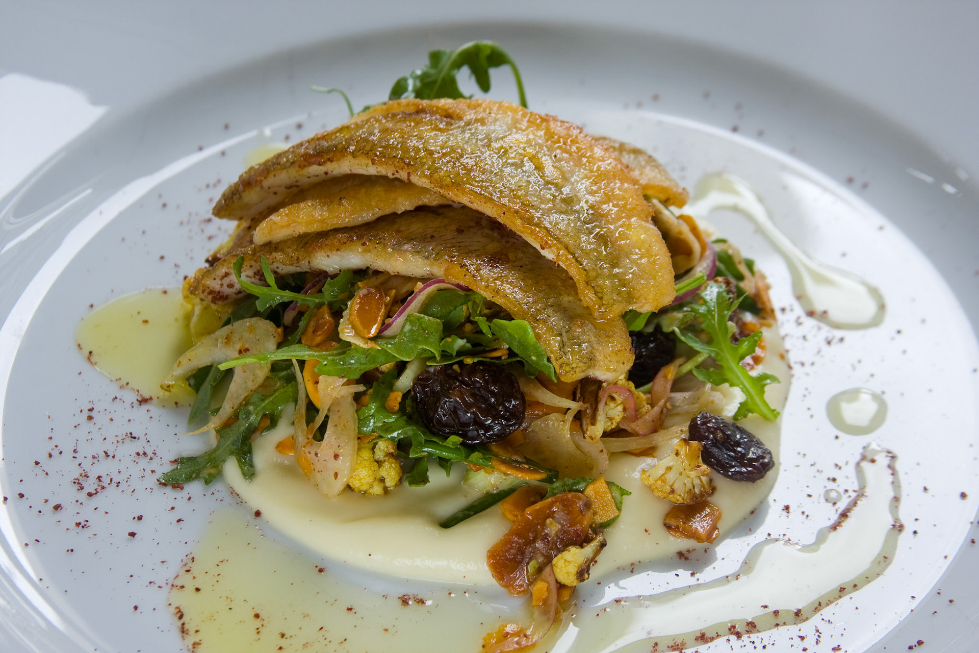 Grilled whiting, curry spiced cauliflower, wild rocket,