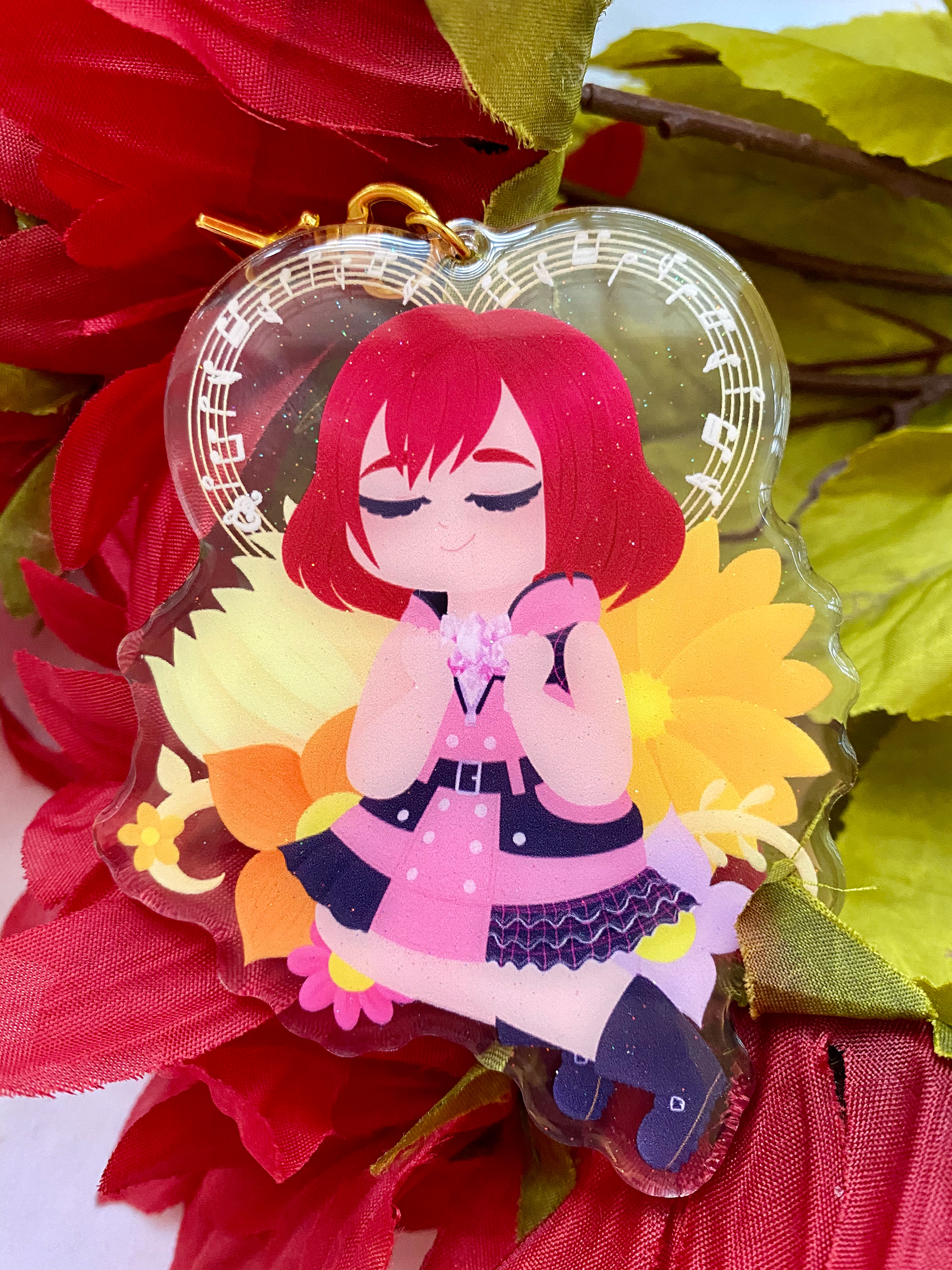 4 inch double-sided clear acrylic charm with a glitter epoxy coating. Charm comes with a golden star clasp.