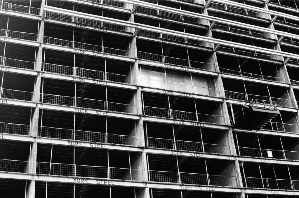 black and white photography of a building under construction