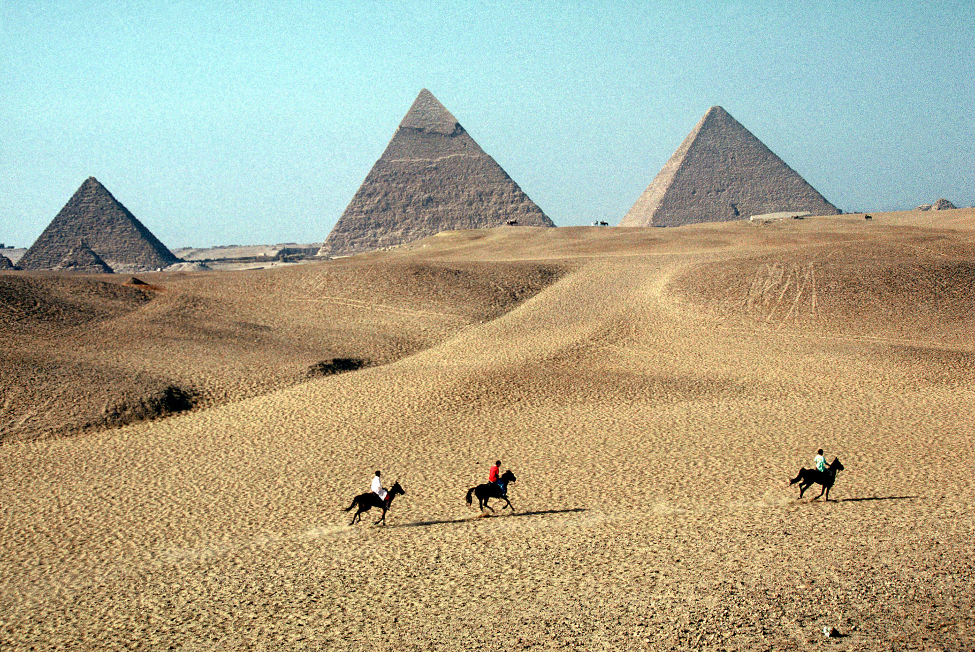 three horses, three pyramids