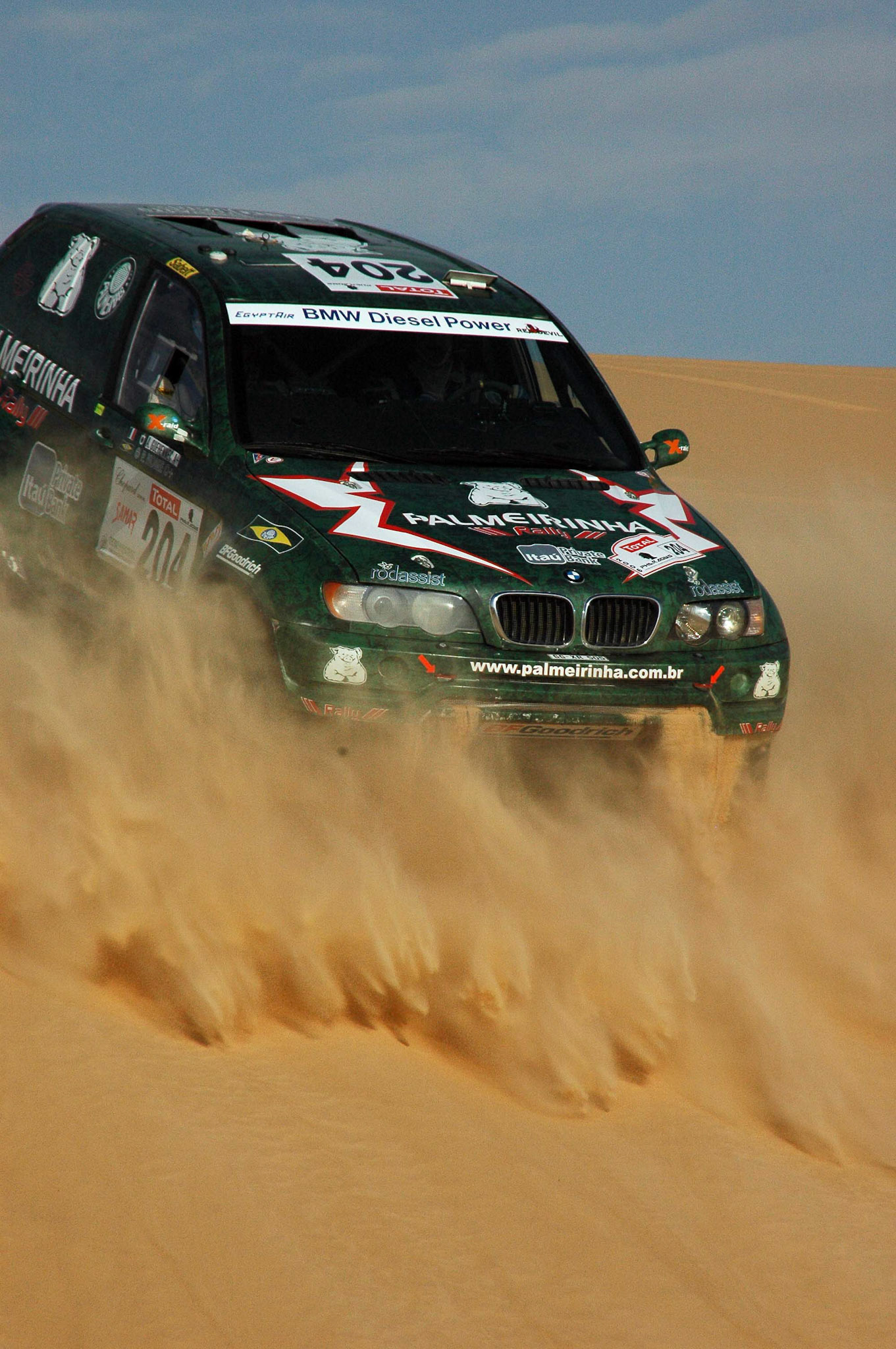 Farafra Oasis, Egypt -- 9 October 2006 -- The  Pharaohs International Cross Country Rally comprises seven days of desert driving for motorcyclists, cars and trucks.  The Russian team car Moscow-ZII (no 201) driven bySergey Shmakov won the race in the cars category.  The Spanish motorcyclist Marc Coma (no 2) driving a KTM 660 Rally won race in the motorcycles category.Photograph by Barry Iverson