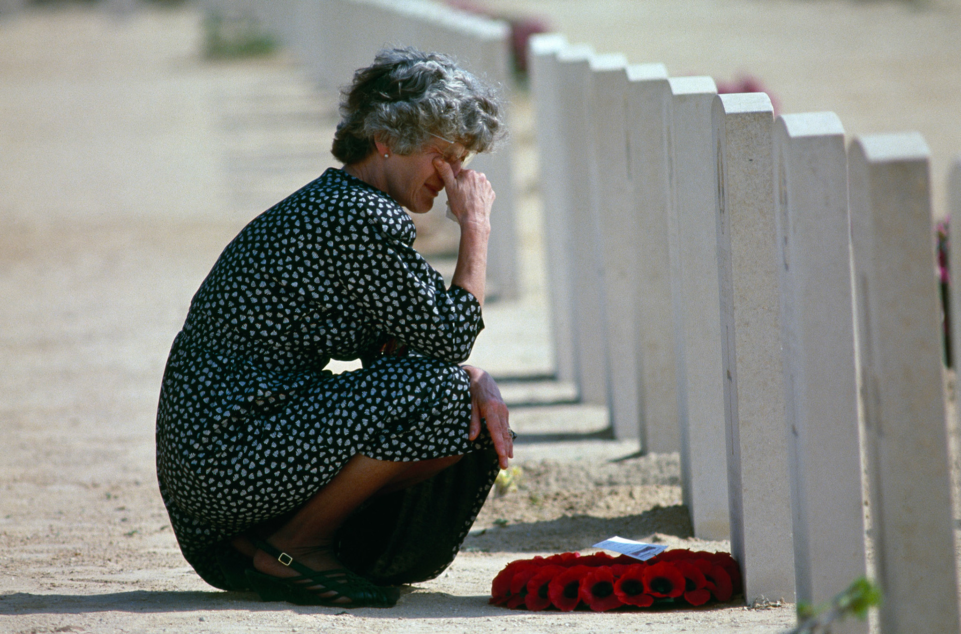 Grieving a fallen relative of World War II at the Commonwealth War Graves Cemetery in Al Alamein.