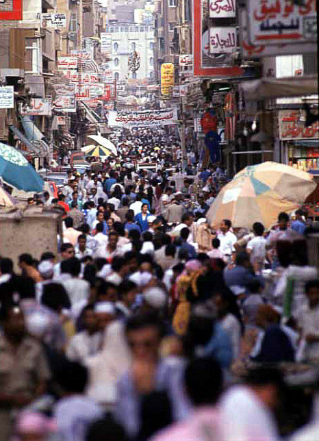 cairo -the scene of masses of humanity on one of cairo's most popular streets - al muski st.