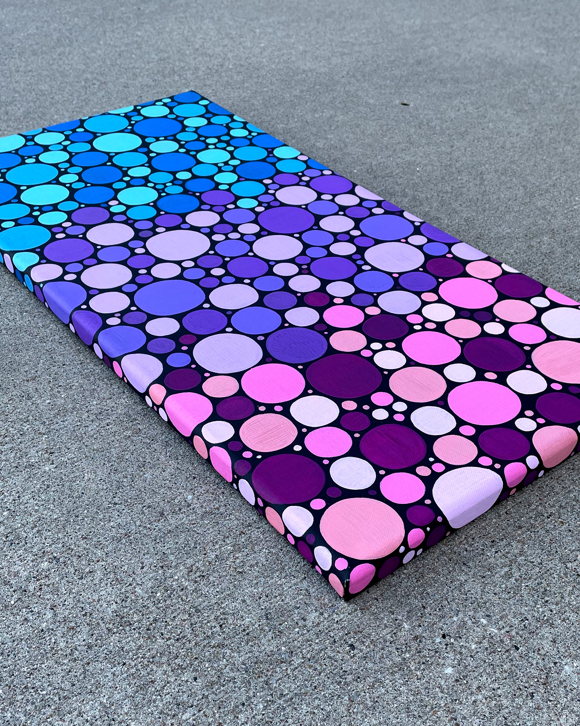 Side of "Mixed Berries," Acrylic on Black canvas. 12 x 24 x 0.5 inches. 2022.