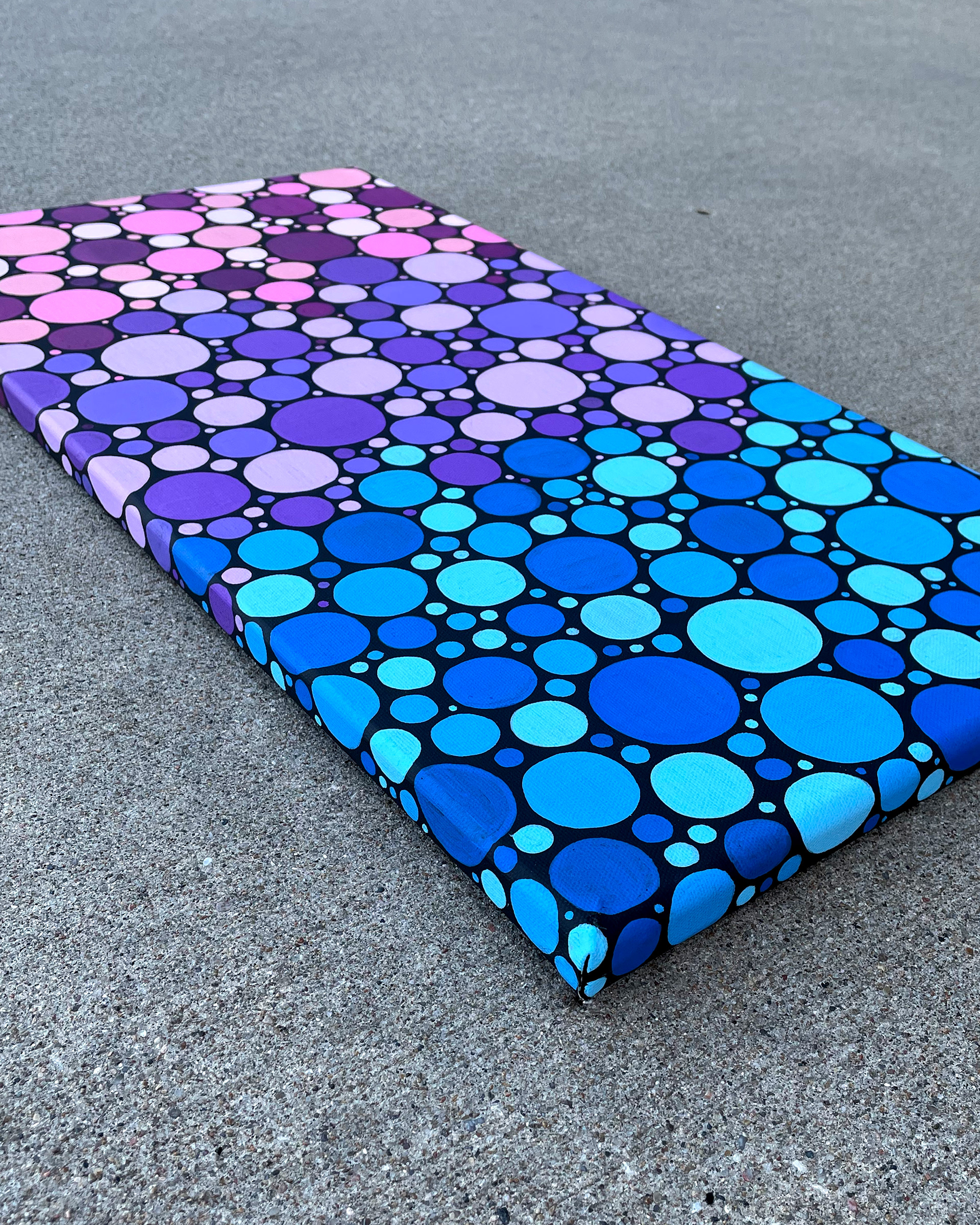 Side of "Mixed Berries," Acrylic on Black canvas. 12 x 24 x 0.5 inches. 2022.