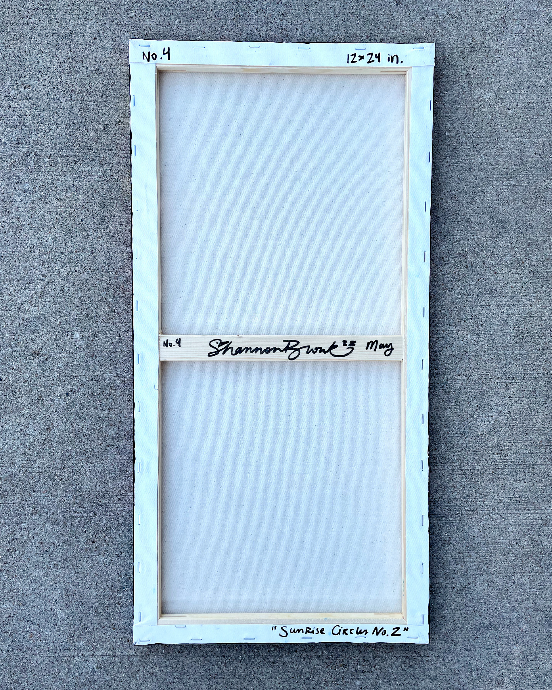 Back of "Sunrise Circles no. 2," Acrylic on canvas. 12 x 24 x 0.5 inches. 2022.