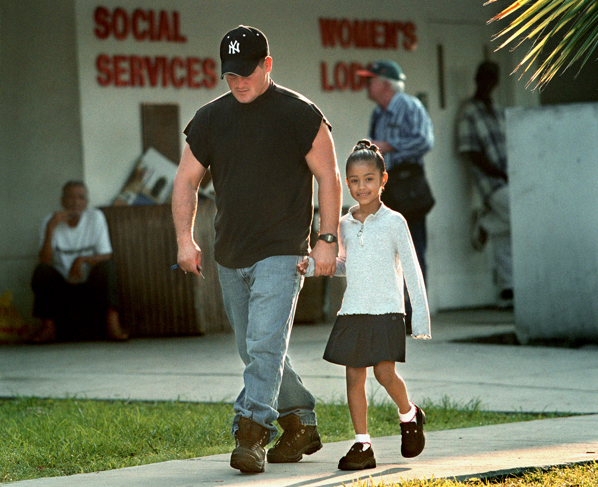 Single father Orlando Valdes takes daughter to school after another night at a homeless shelter.