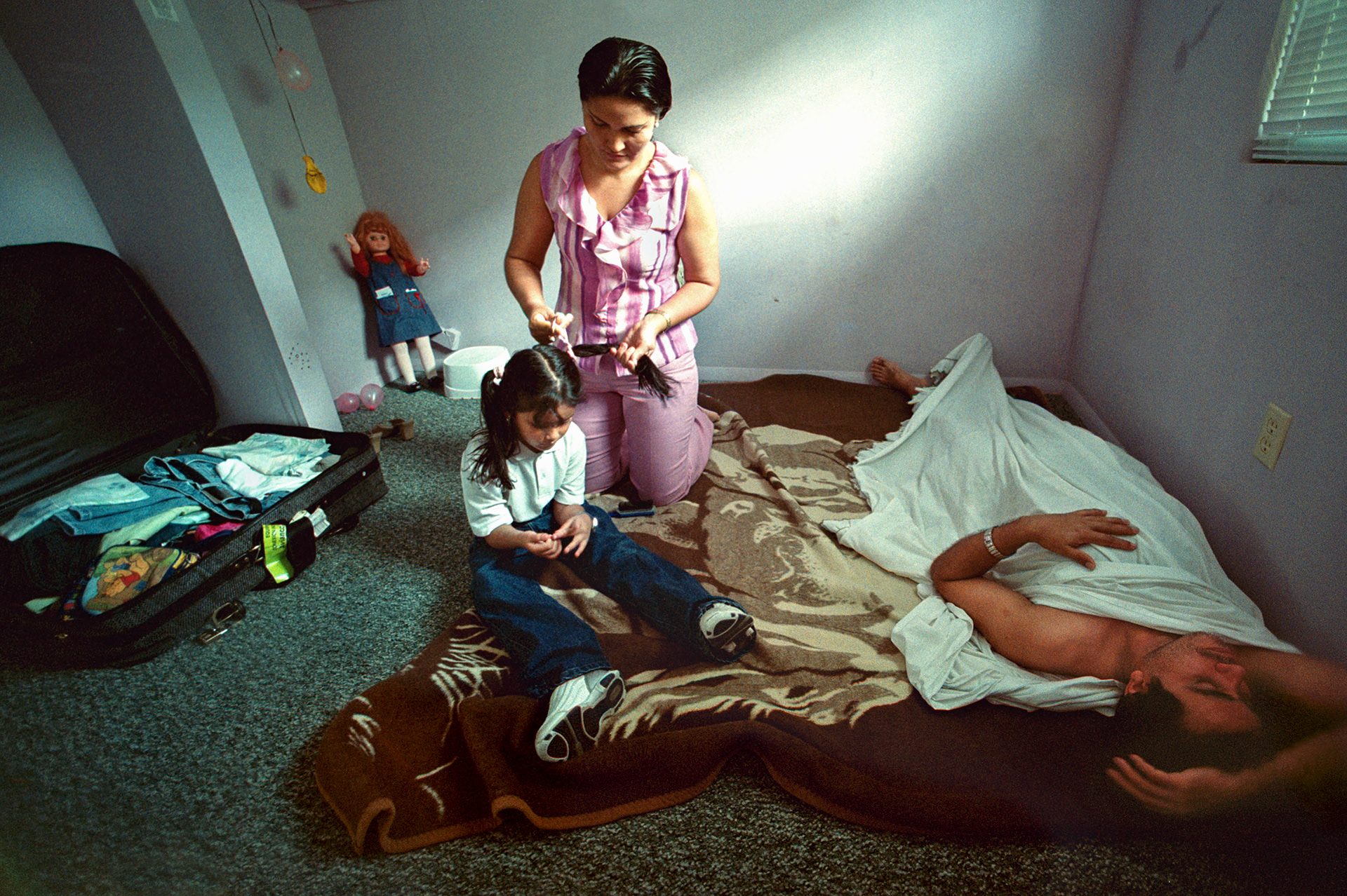 The Herrera family lives out of a suitcase staying where they can.