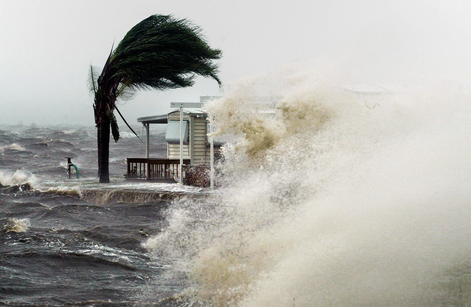 Wave crashes into mobile home park at Jensen Beach as Hurricane Frances moves in.