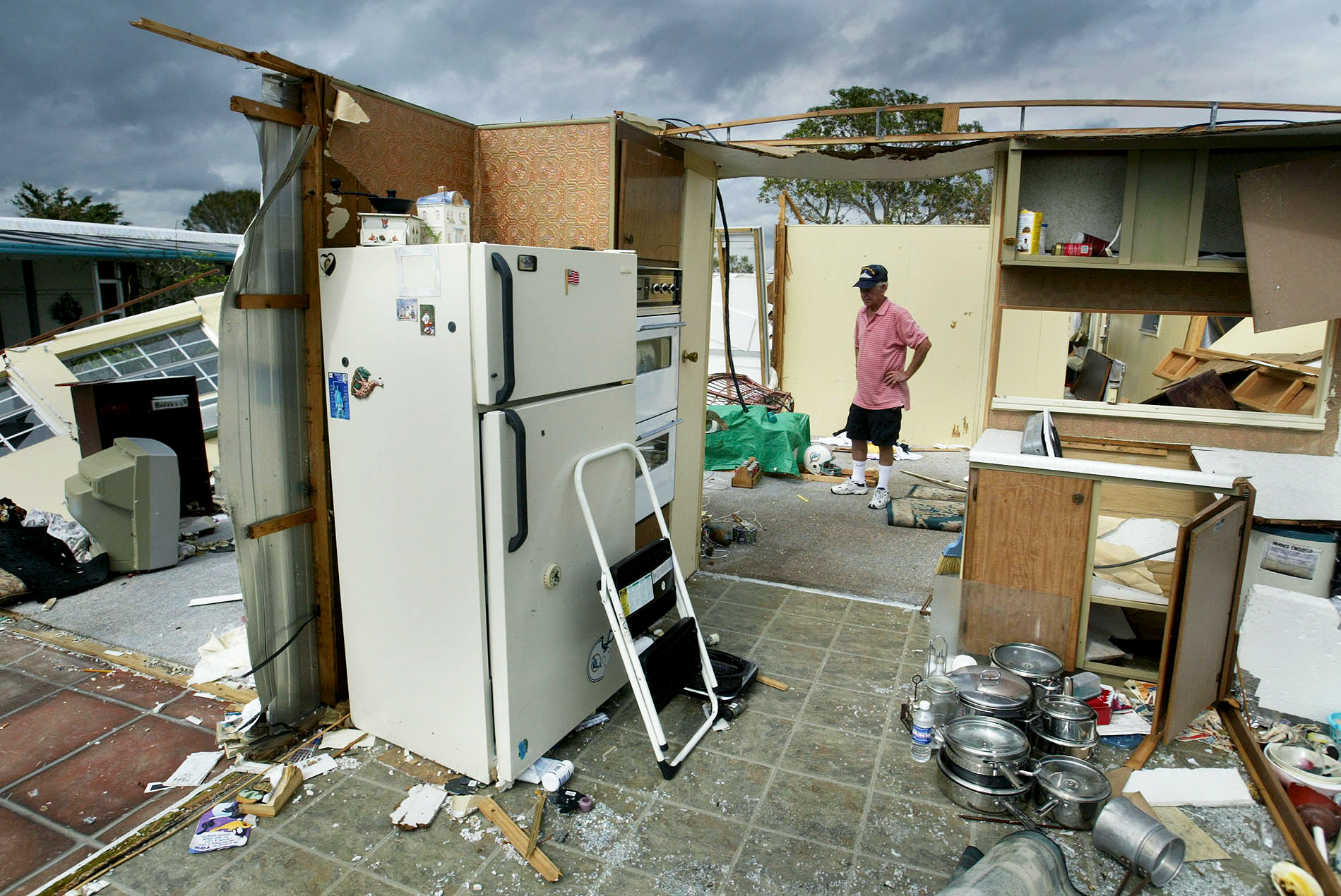 William Sims stands unsure of what do next in his destroyed home.