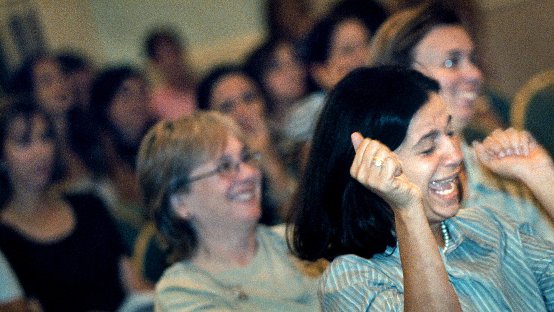 Elizabeth Cardozo is overjoyed as her son’s name is called for enrollment in new charter school.