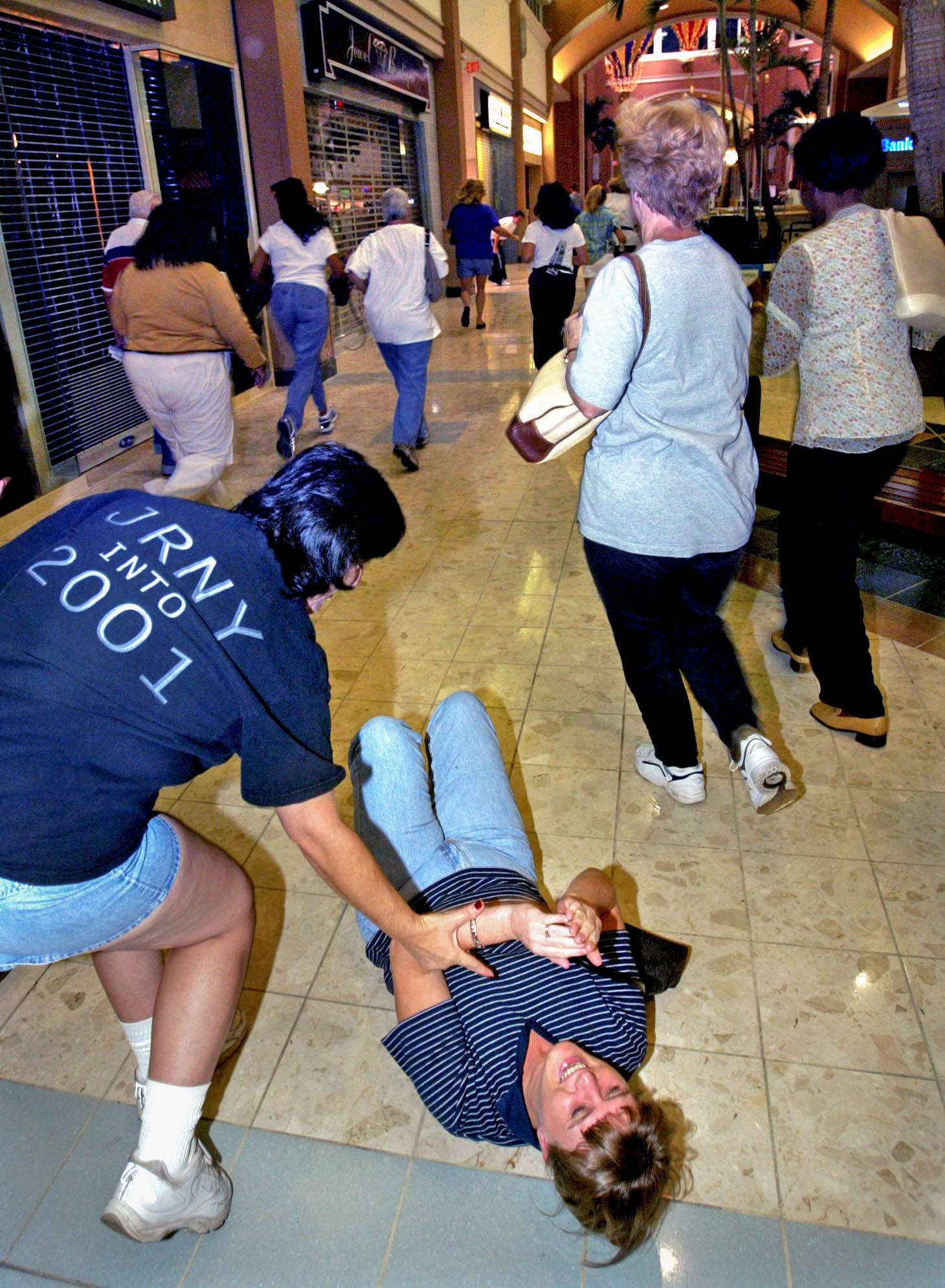 Woman tumbles during opening sprint.
