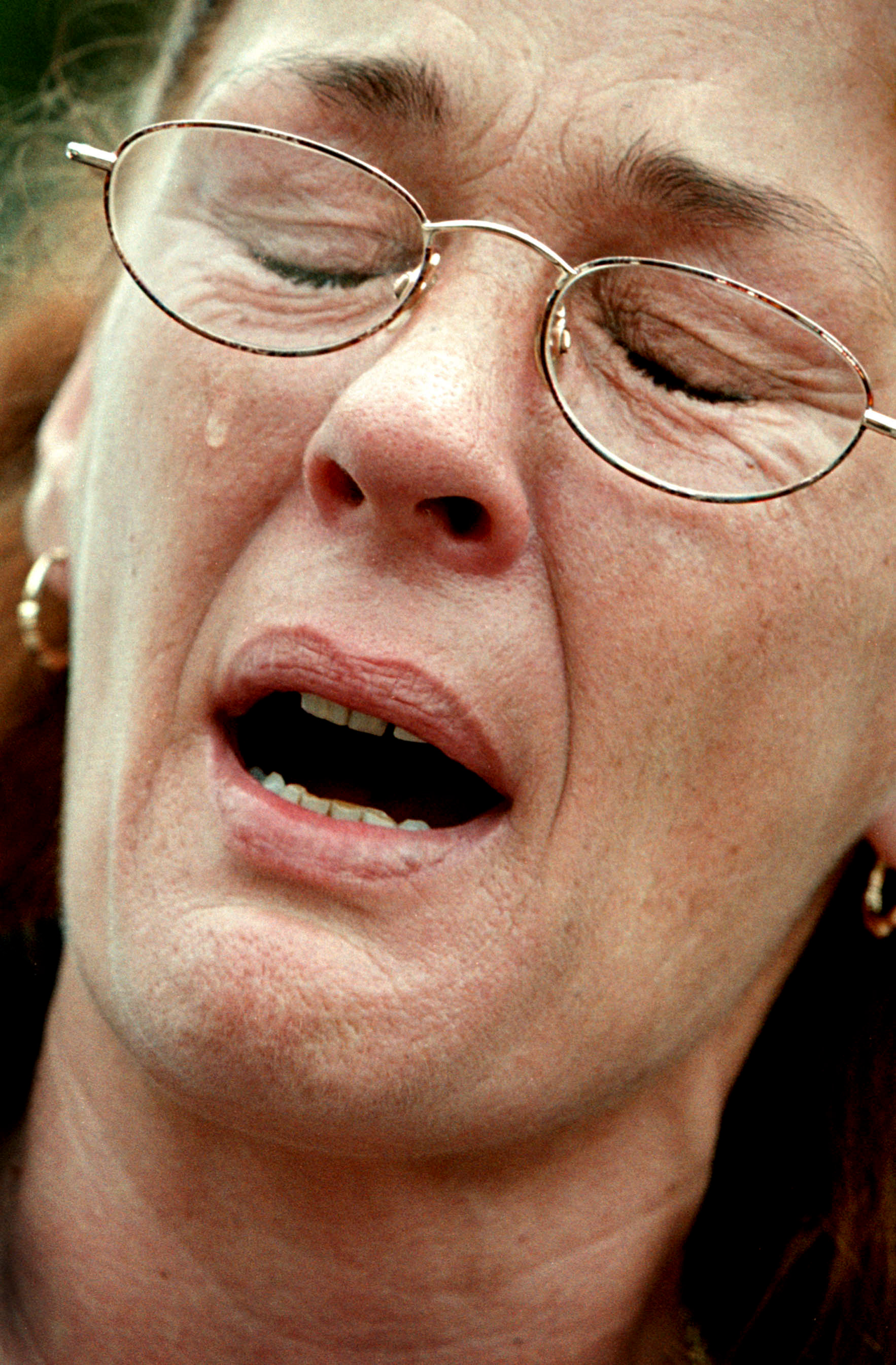 Denise Neely weeps for her evicted grandchildren, vicims of a slumlord.