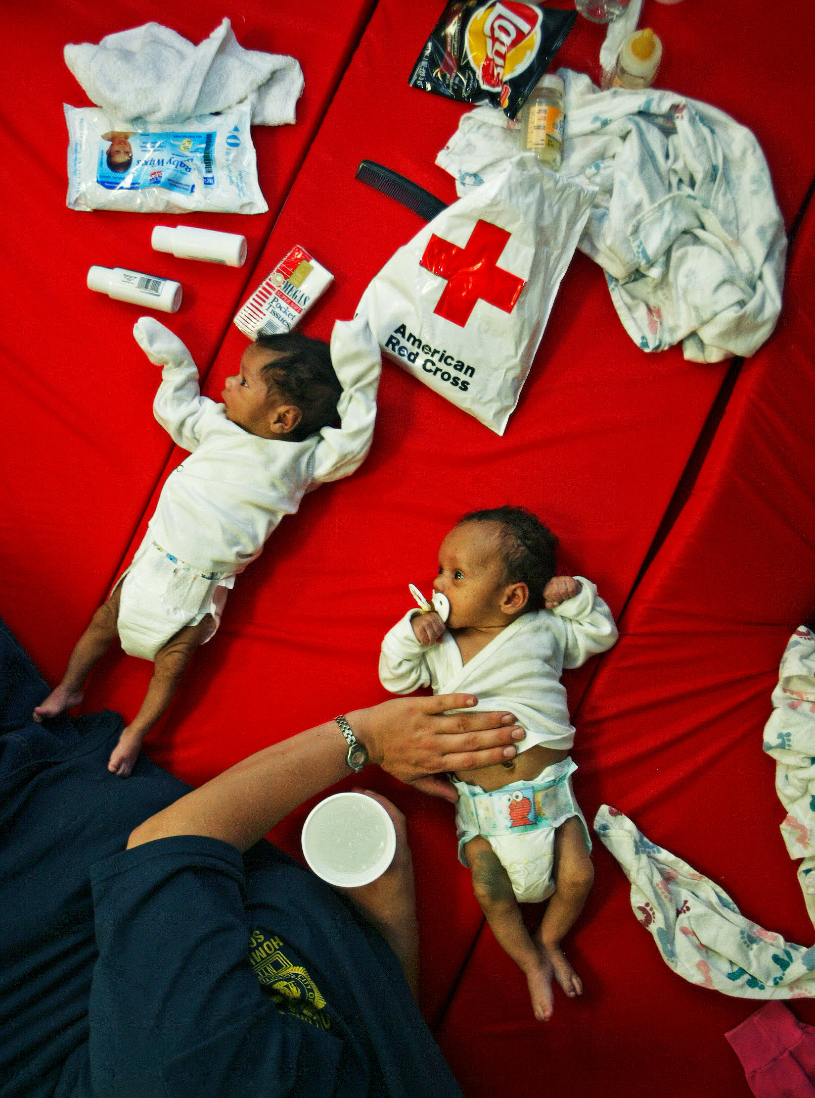 Family with twins stay at Red Cross shelter after Hurricane Charlie destroyed their home.