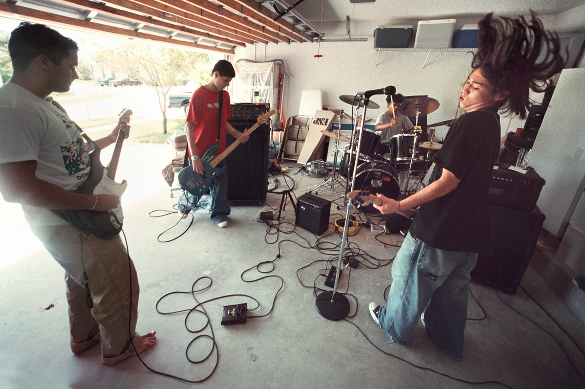 High school rock band Pure practice in garage of the home of Max Knowles, right.