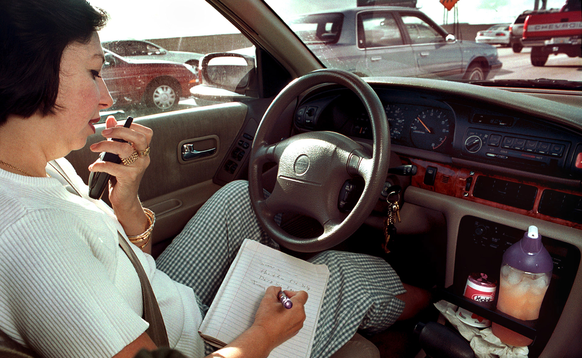 Fanny Gerdts juggles her job, drive and breakfast while stuck in traffic while commuting to work.