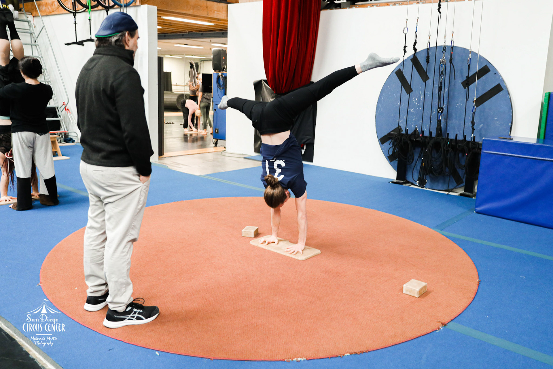Coach Jean-Luc Martin Watching Straddle Handstand