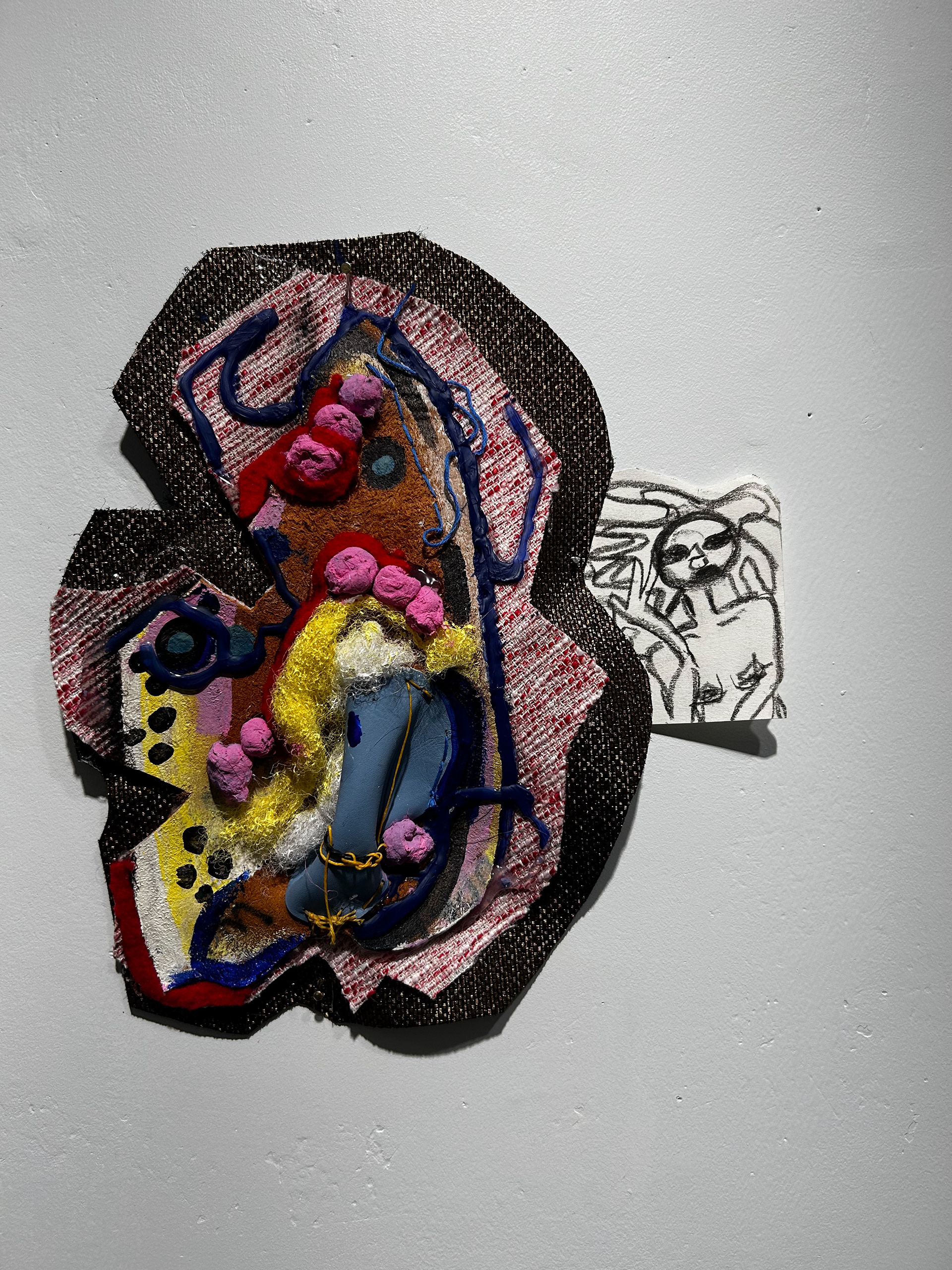 "everything clicked when I got out the shower" 6in by 7in. embroidery thread, hot glue, acrylic, cotton and felt on leather