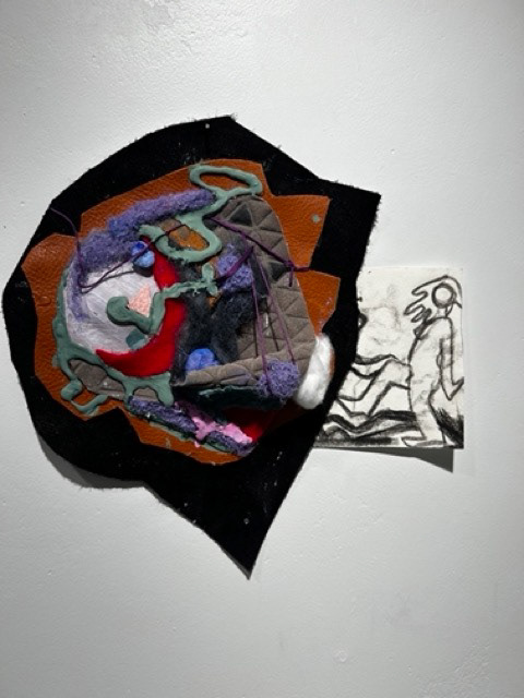 "im thinking in my room, naïveté thought away" 4in by 5.5 in hot glue, acrylic ,embroidery thread on leather