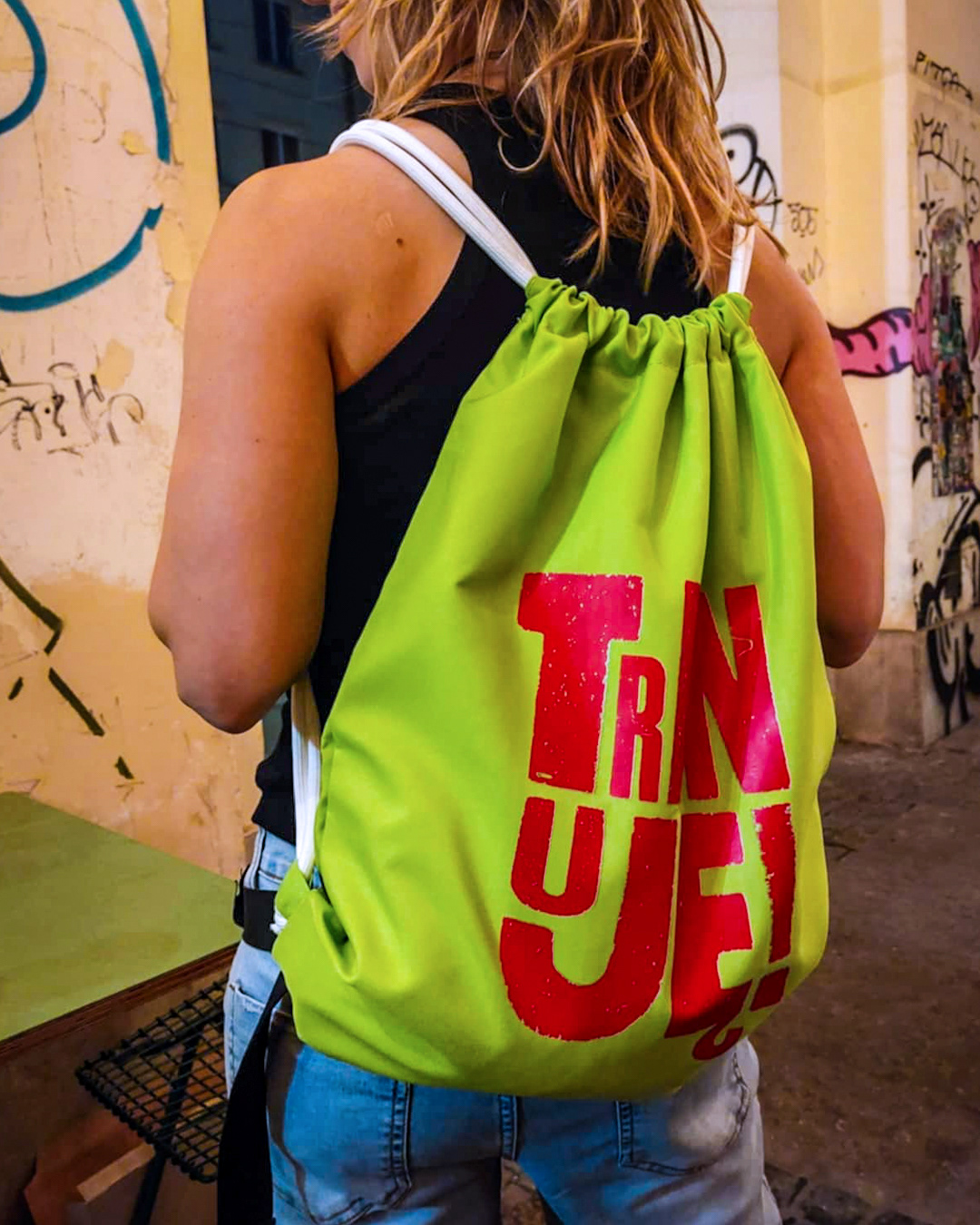Waterproof drawstring bag with “Trenuję” typography for Loco!Motion brand.