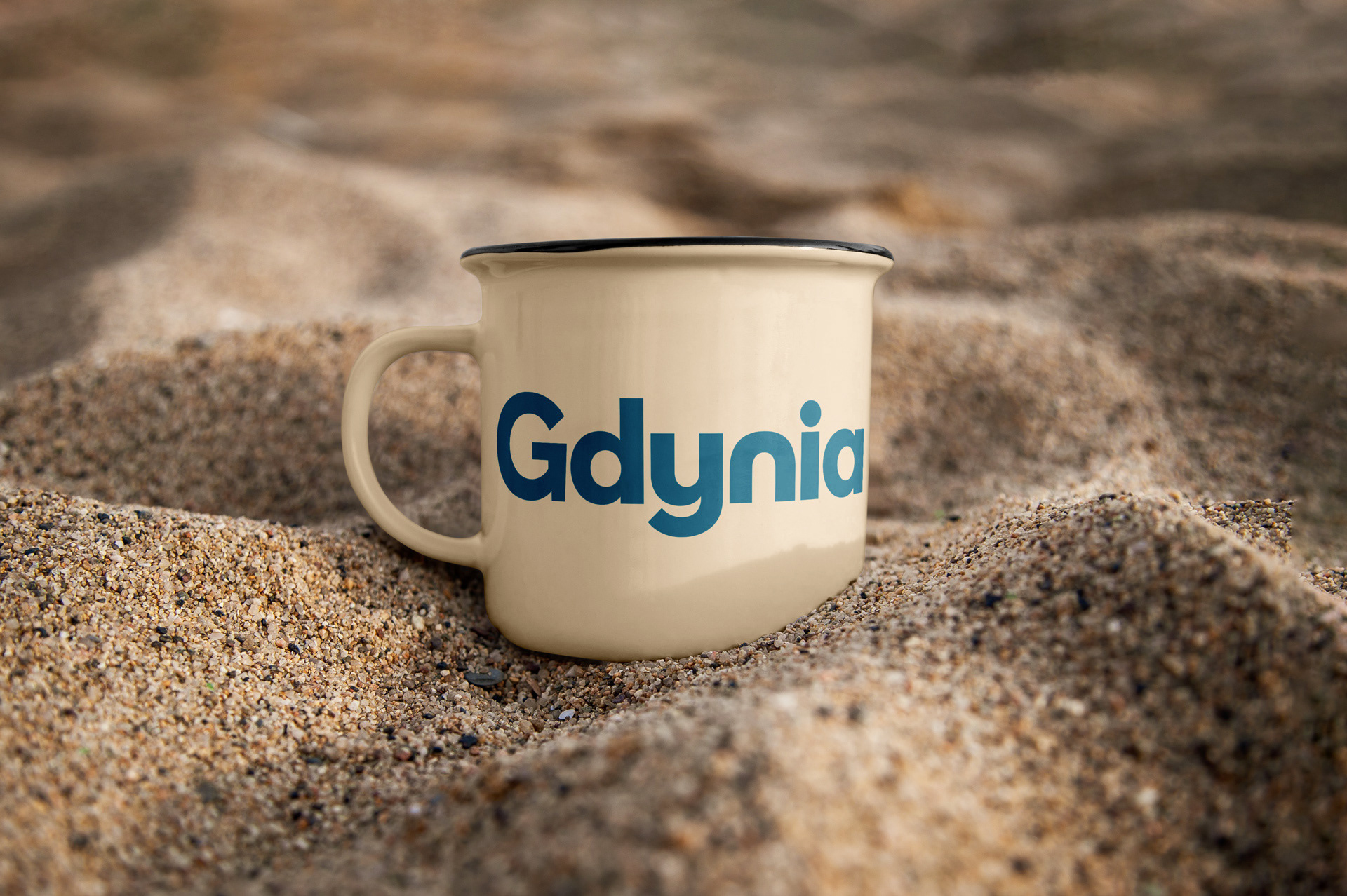 Steel mug featuring the Gdynia logotype. Brand design by Magda Kowalska creepart.