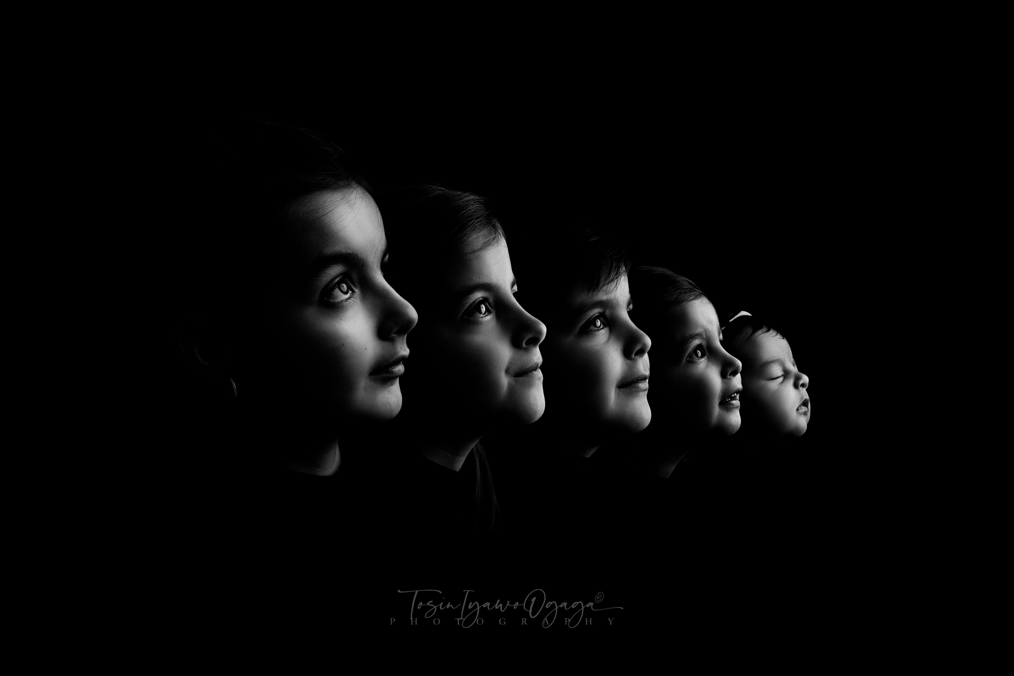Timeless black and white image of five siblings including a newborn by TIO Photography