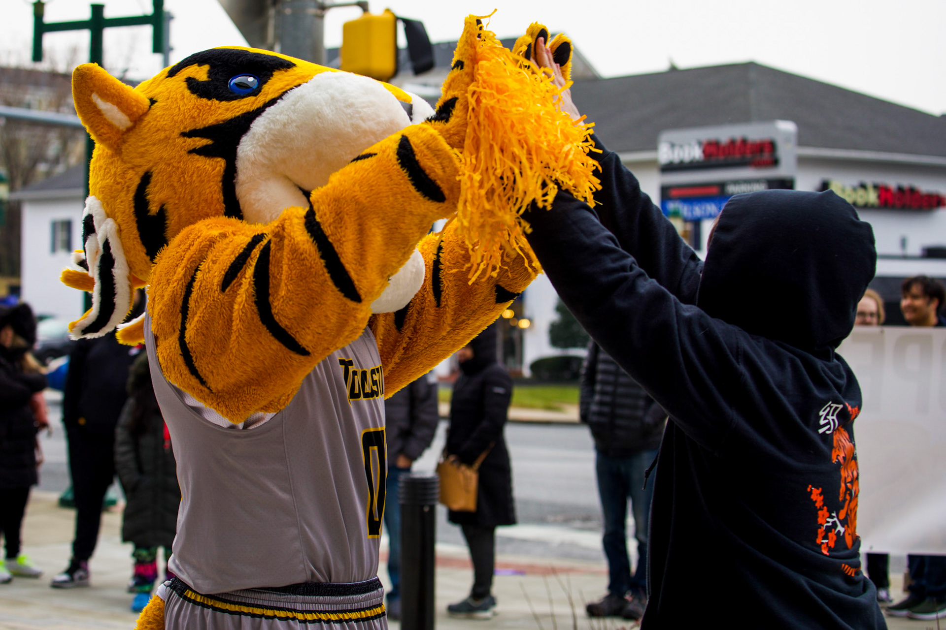 Doc the Tiger giving a high-five