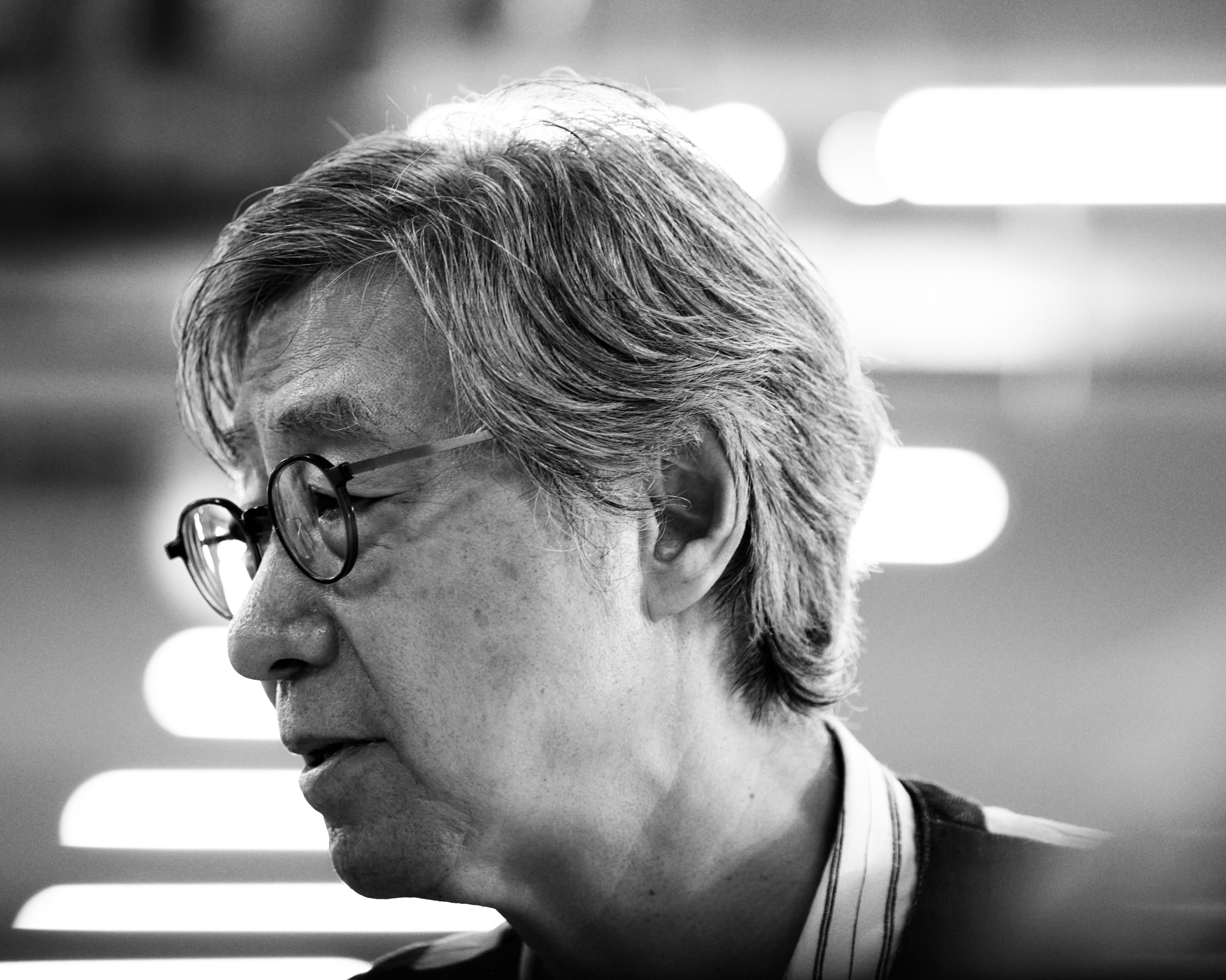 Photographer Bohnchang Koo supervising print quality for Frieze Seoul × Shinsegae