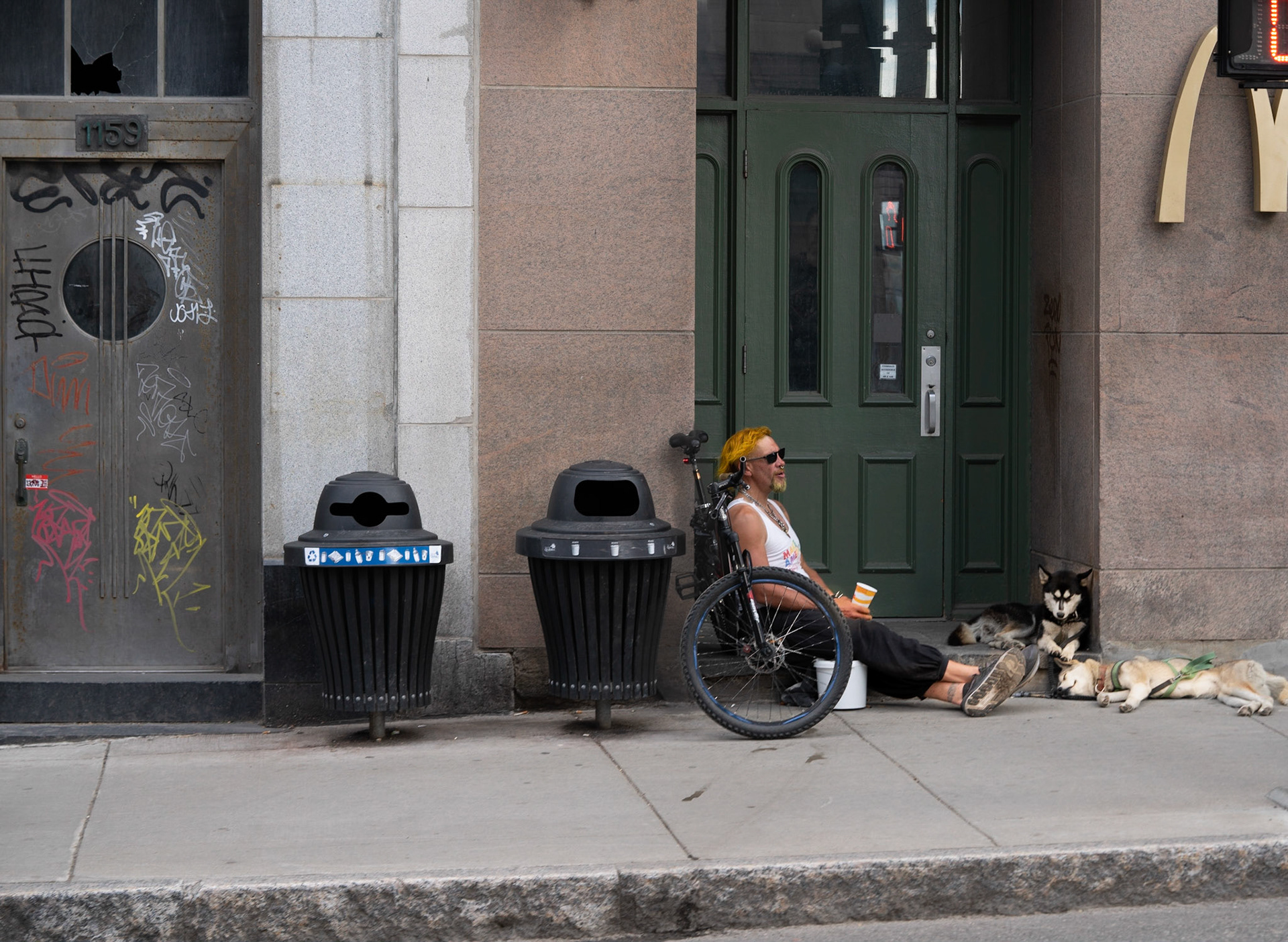 Steet person relaxing with his 2 friends