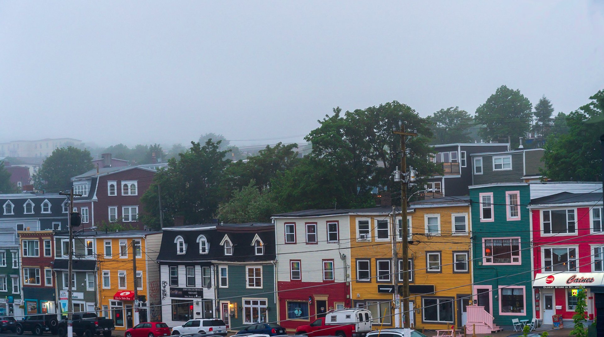 Colourful Cabot Tower, which commemorates John Cabot's discovery of Newfoundland row homes facing harbour.