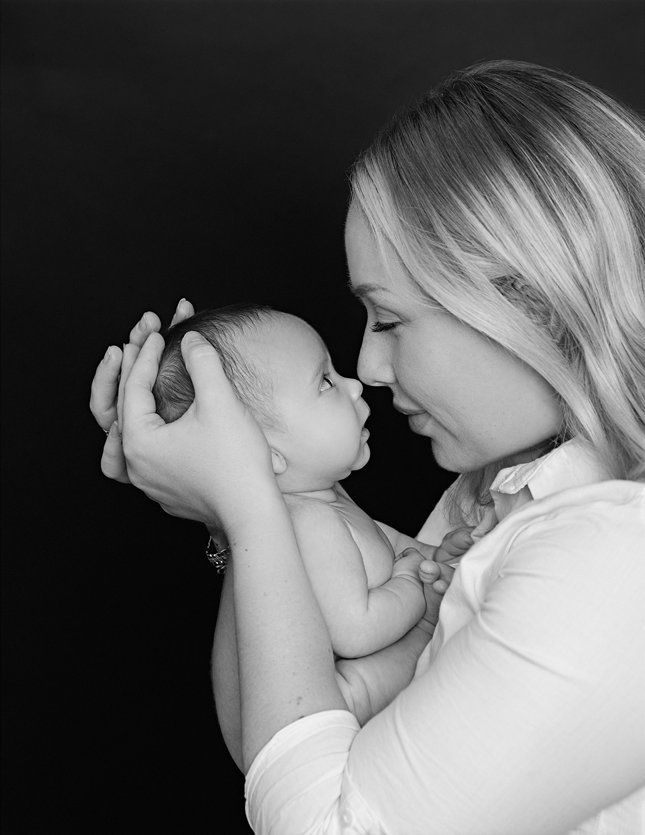 Black and White Studio Portrait of a Mother and Baby