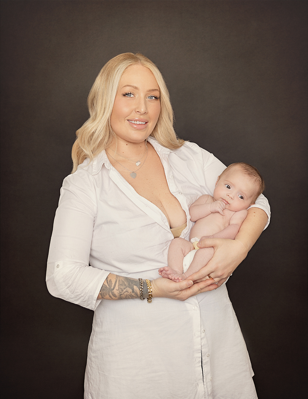 Mother with Newborn baby in Studio Portrait