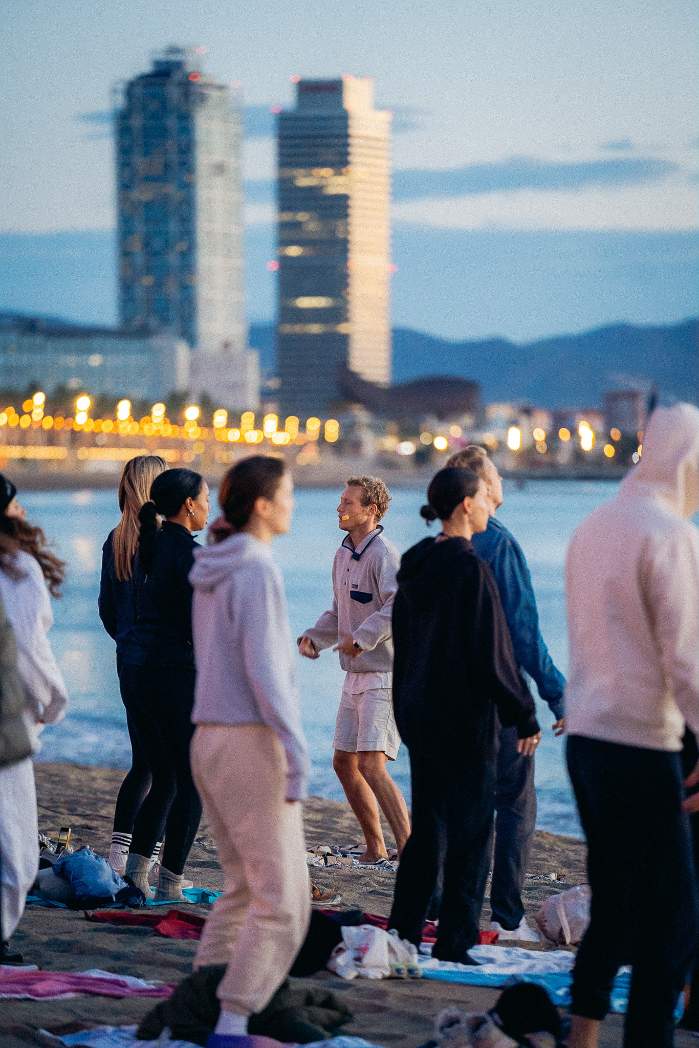 Sunrise spiritual ceremony on the beach in Barcelona documented with video and wide shots for immersive storytelling