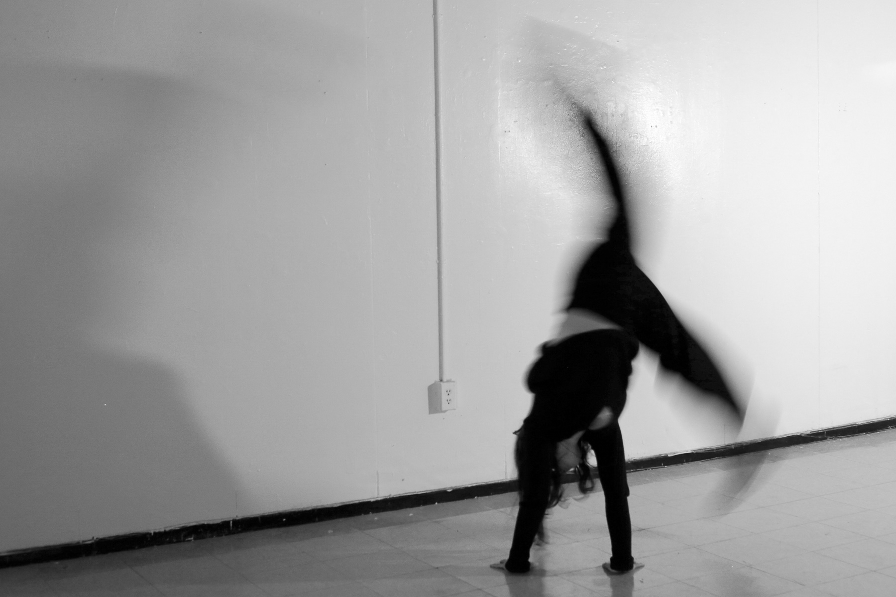 Anya Nikulina stops by one of the studio spaces in Boston University's College of Fine Arts to do a few somersaults and handstands, procrastinating a painting she has to get done; January 30th, 2025.