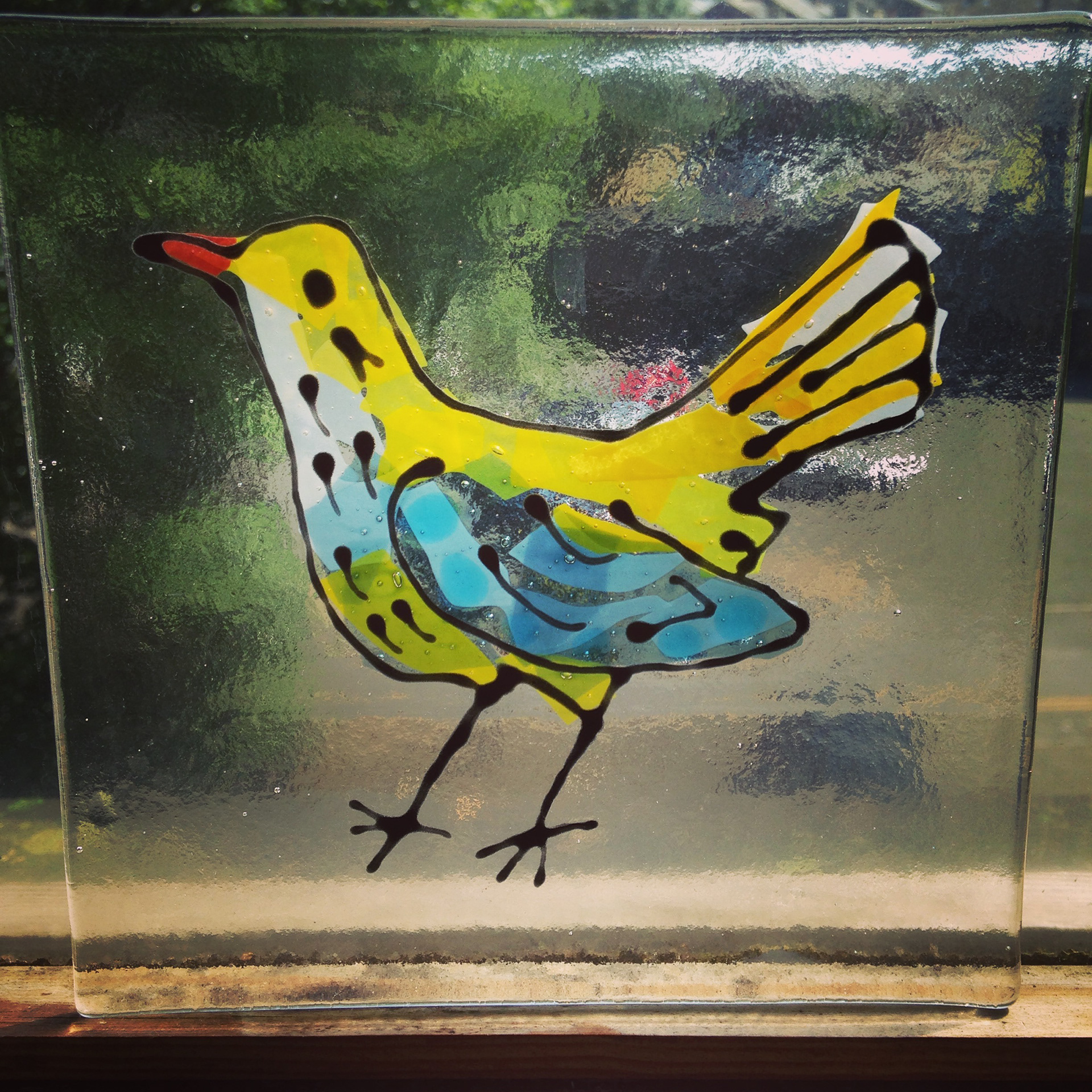 Fused and stained glass birds tiles. Kiln fired. Made by Zoe Eady at the Glass Garden, Leeds. Yellow