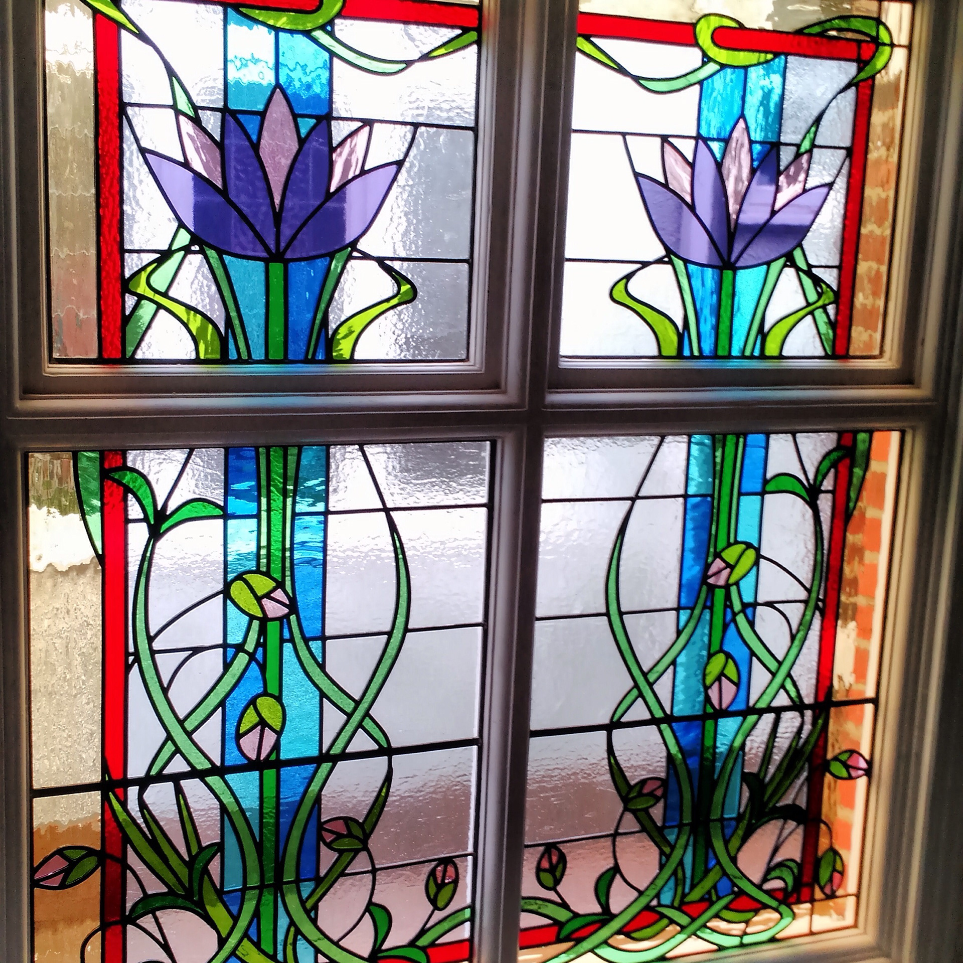 Traditional Stained glass leaded light original Art Nouveau theme by Zoe Eady of The Glass Garden. Compound design - Lotus flowers with buds entwining between the panels.