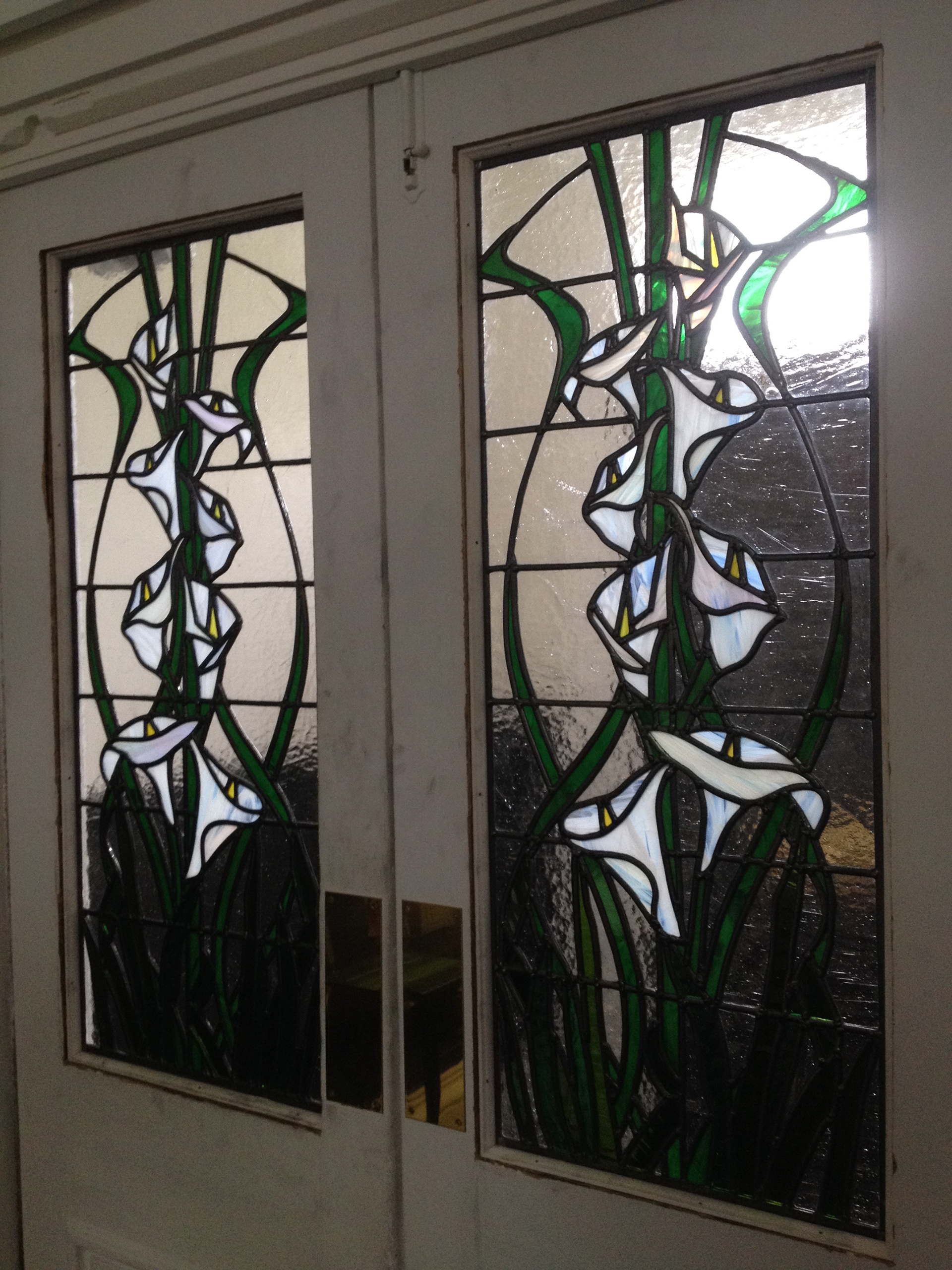 Traditional Stained Glass and art glass panels using Art Nouveau theme by Zoe Eady of The Glass Garden. Calla Lilly and ivy swing door panels
