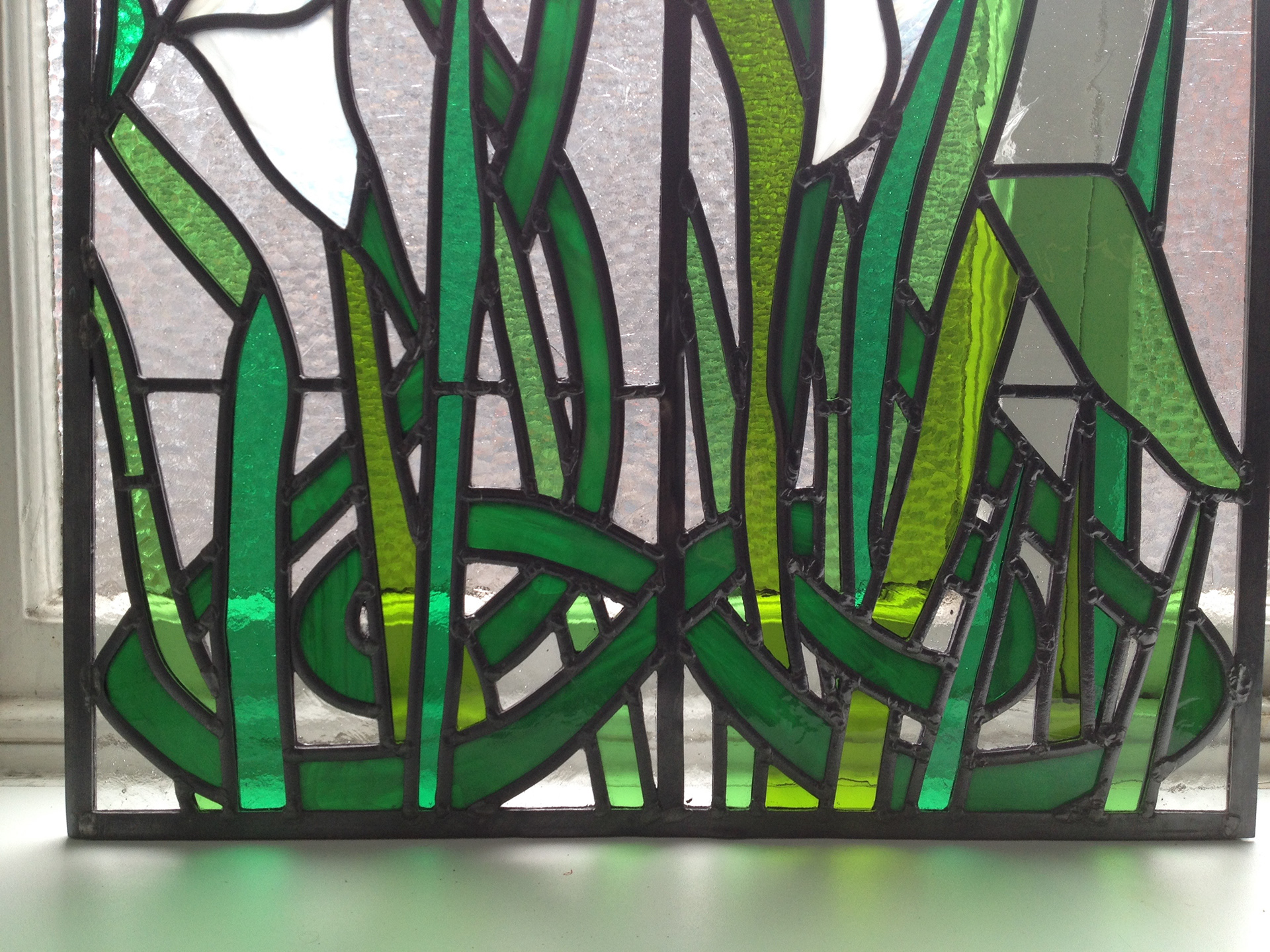Traditional Stained Glass and art glass panels using Art Nouveau theme by Zoe Eady of The Glass Garden. Calla Lilly and ivy - close up of knot.