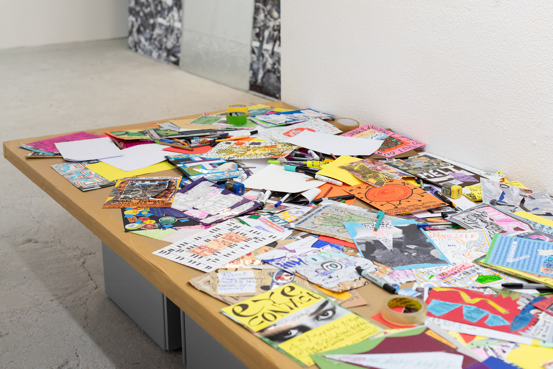 Nice Gmo - Table-sculpture (2025) - various stationary on cardboard with metal supports - 240 x 120 x 55 cm