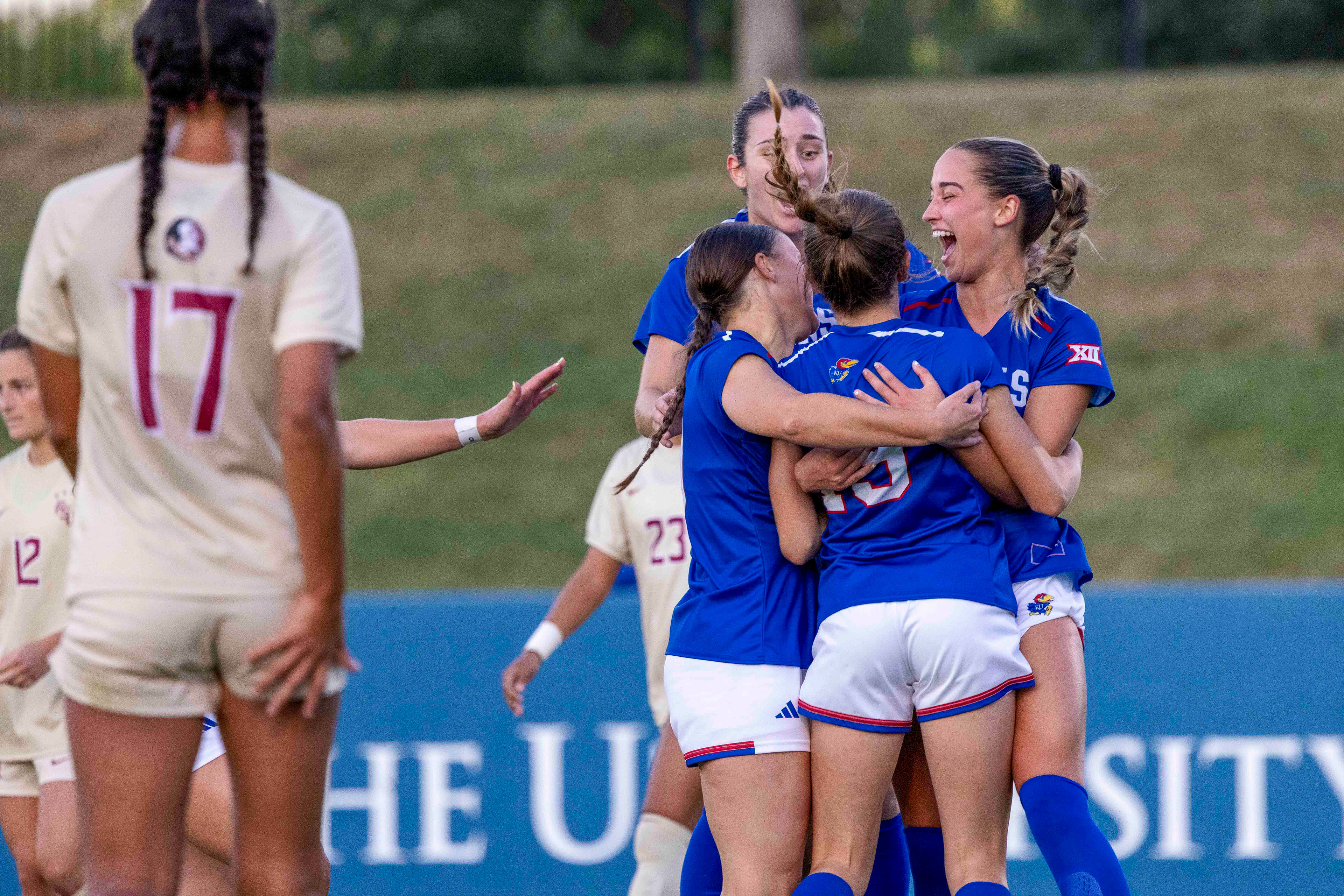 The KU women's soccer team celebrates a goal scored by Mary Sola against Florida State on Thursday, Aug. 28, 2025, at Rock Chalk Park in Lawrence, Kan.