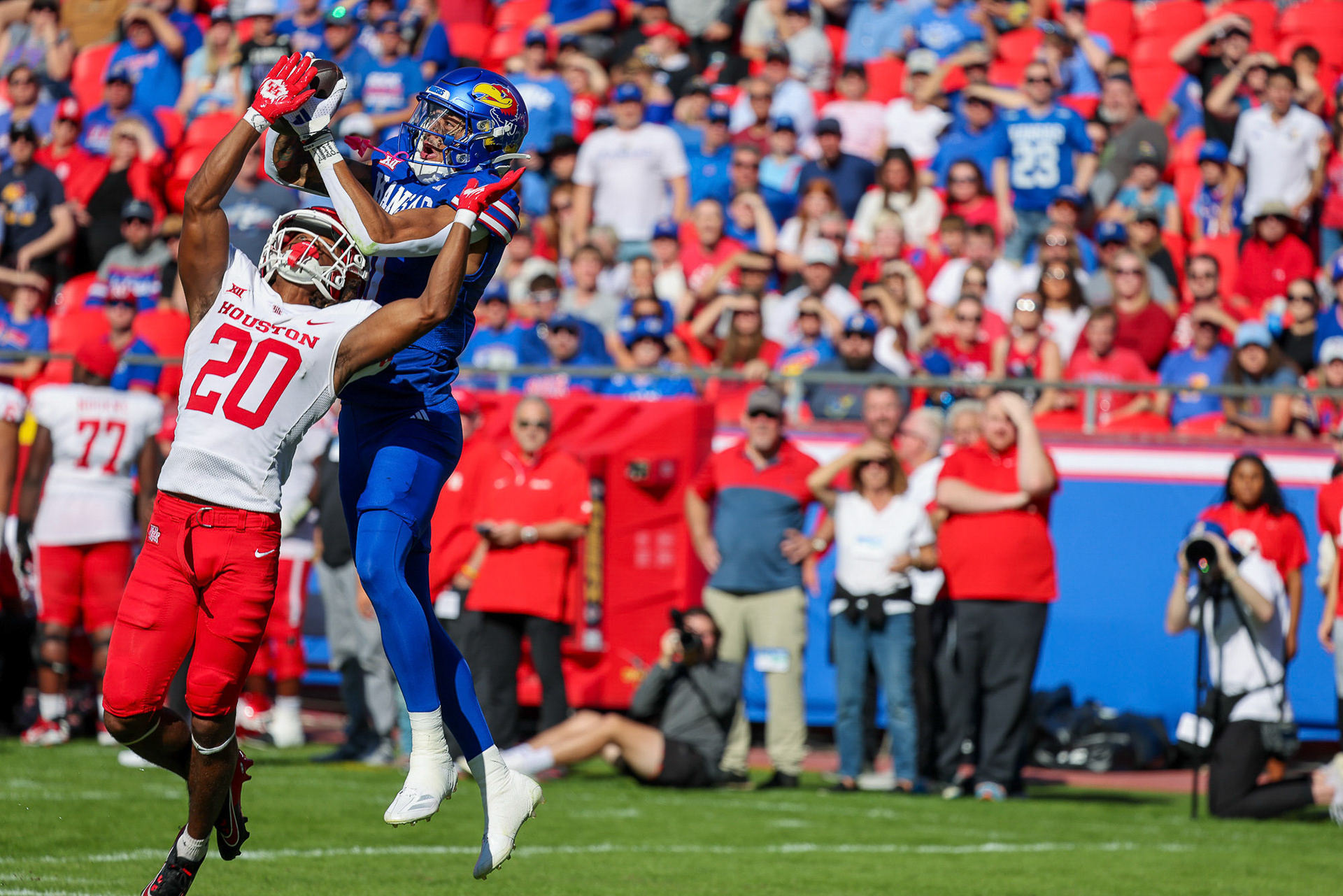 Kansas receiver Quentin Skinner leaps over Houston’s Jeremiah Wilson for a touchdown catch at Arrowhead Stadium on Saturday, Oct. 19, 2024, in Kansas City, Mo.
